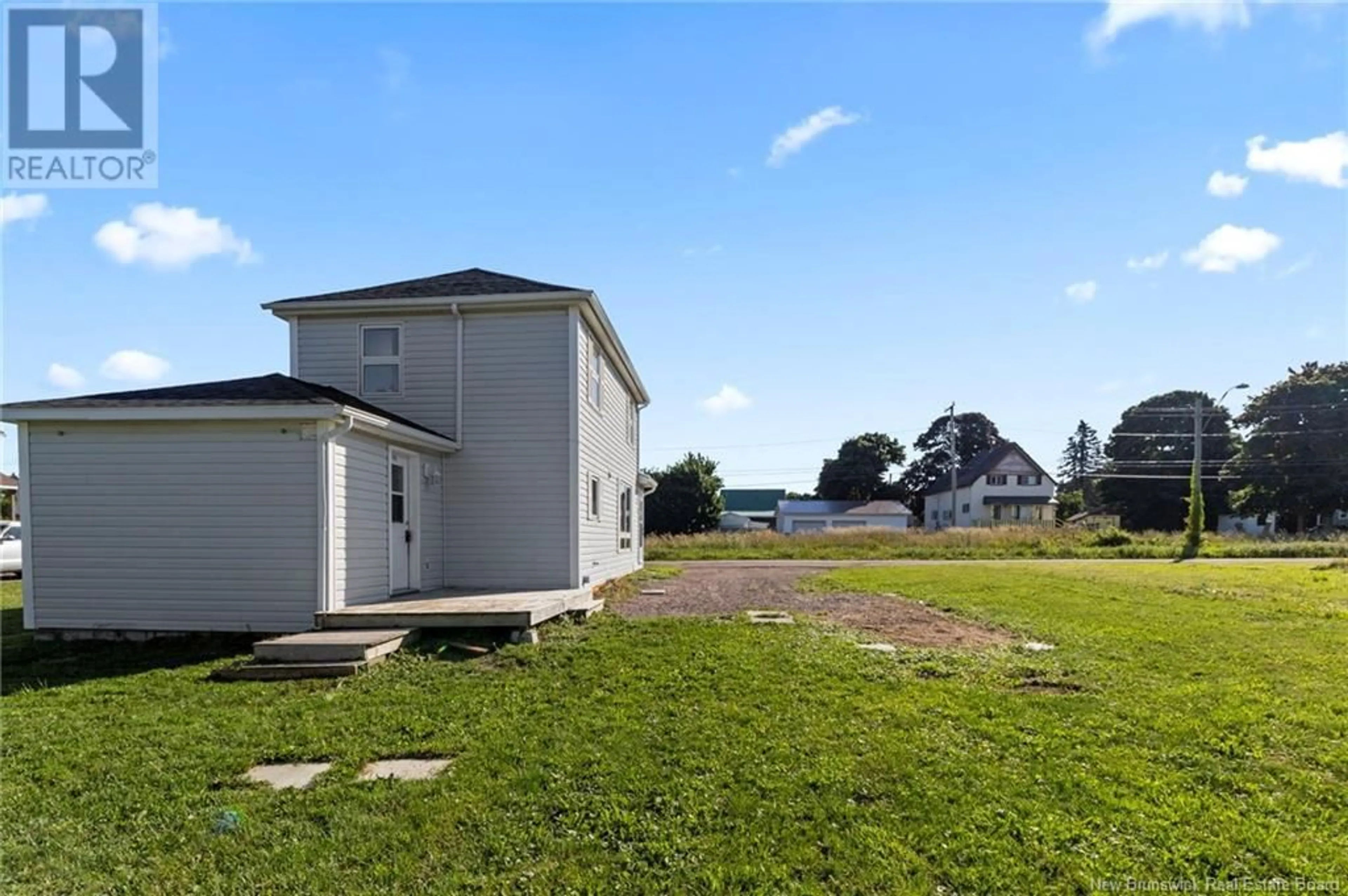 Frontside or backside of a home, the fenced backyard for 61 Mill, Shediac New Brunswick E4P2H8