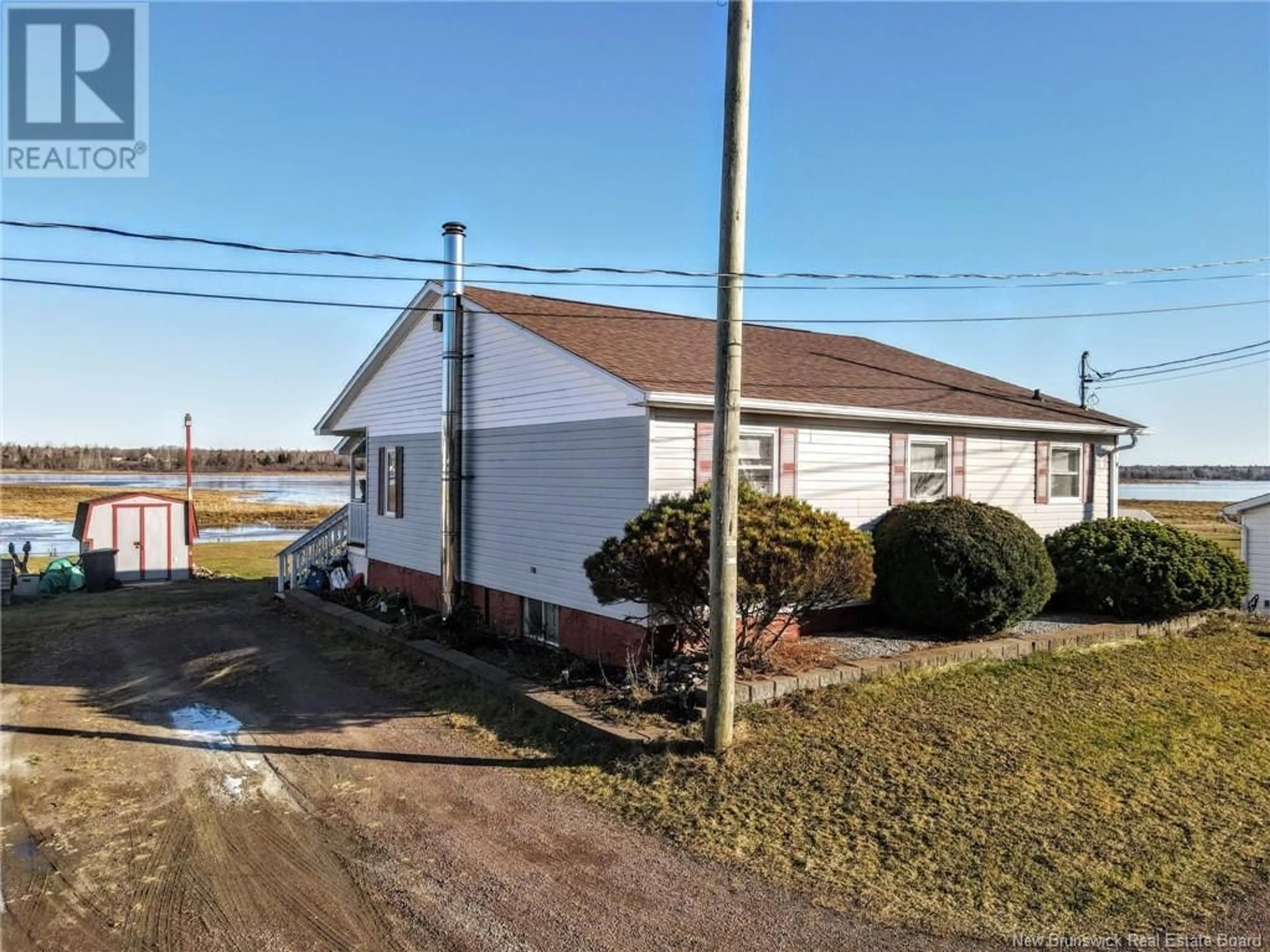 A pic from outside/outdoor area/front of a property/back of a property/a pic from drone, building for 51 Thibodeau Street, Grand-Barachois New Brunswick E4P8P4