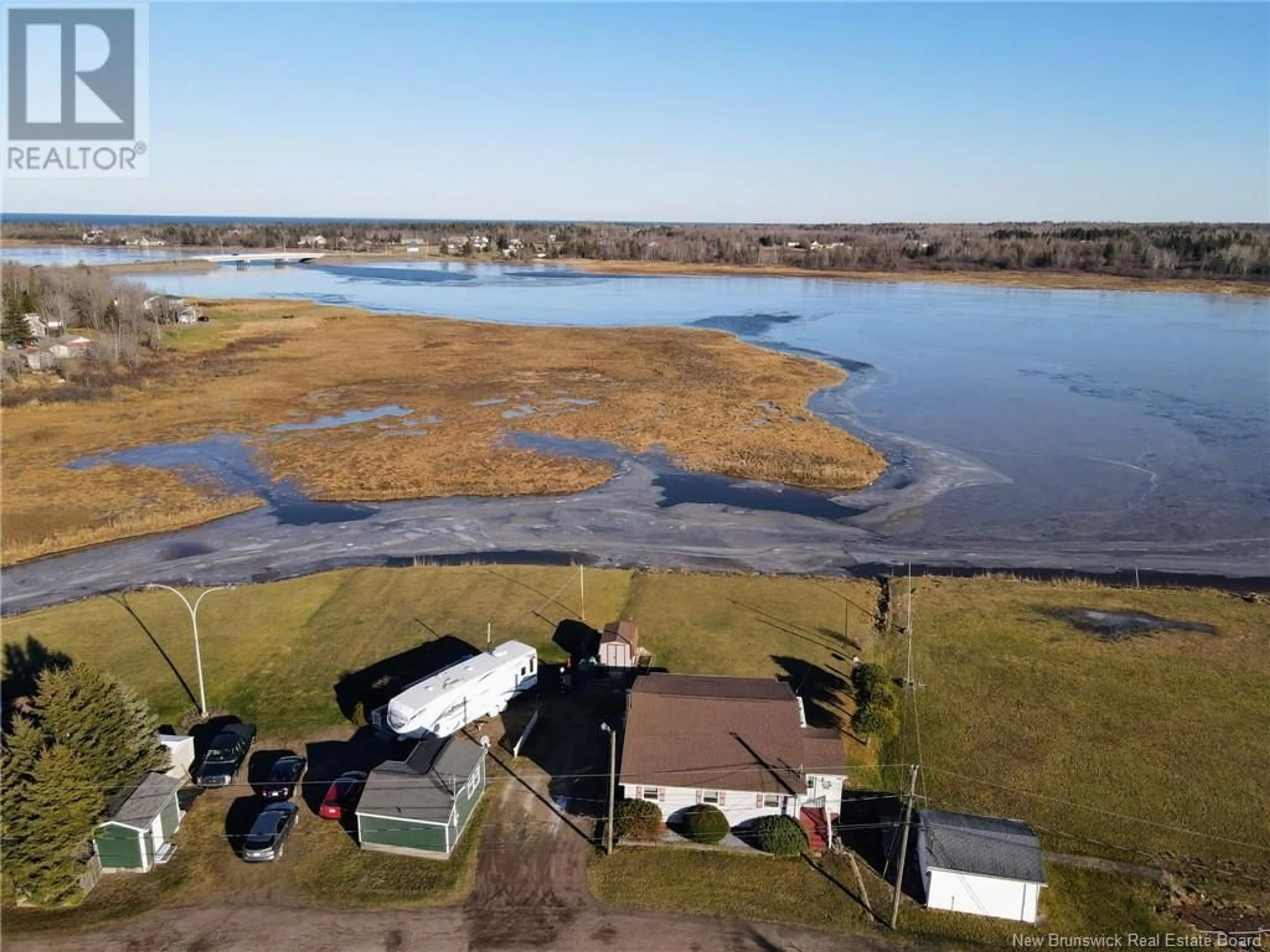 A pic from outside/outdoor area/front of a property/back of a property/a pic from drone, water/lake/river/ocean view for 51 Thibodeau Street, Grand-Barachois New Brunswick E4P8P4