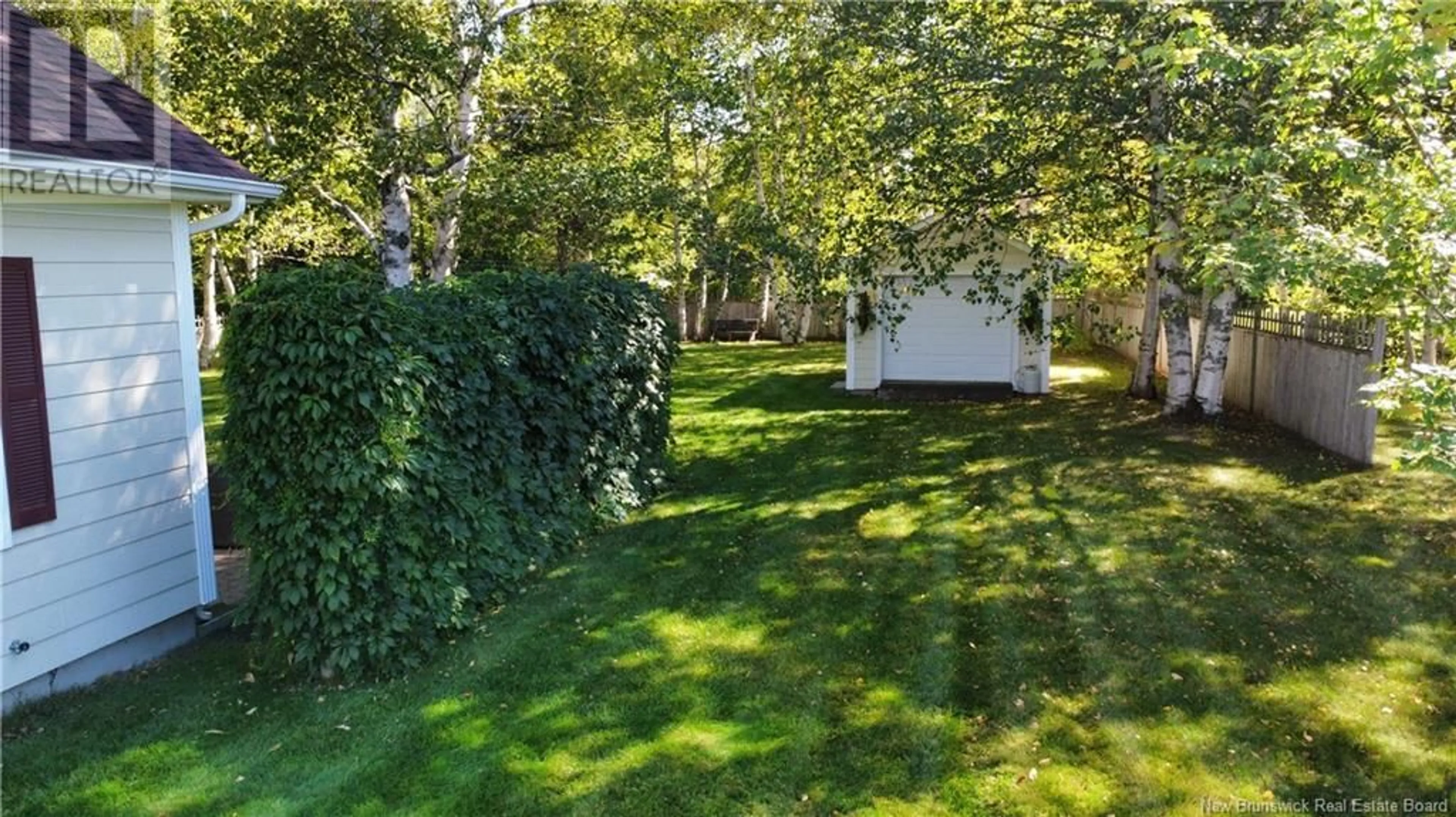 A pic from exterior of the house or condo, the fenced backyard for 223 Rue Du Moulin, Nigadoo New Brunswick E8K3M3