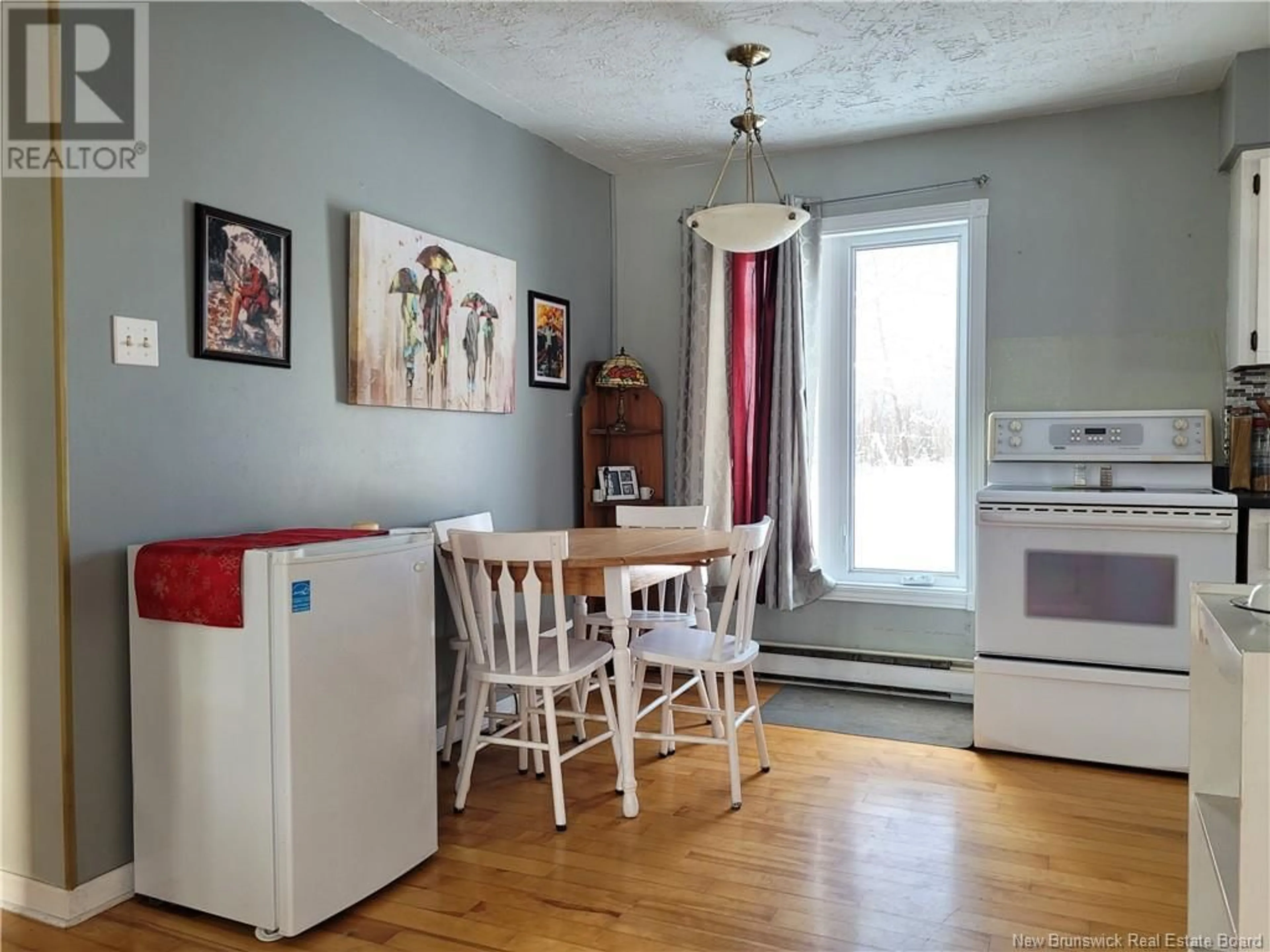 Dining room, wood floors, cottage for 1784 Cormier Road, Robertville New Brunswick E8K2T9