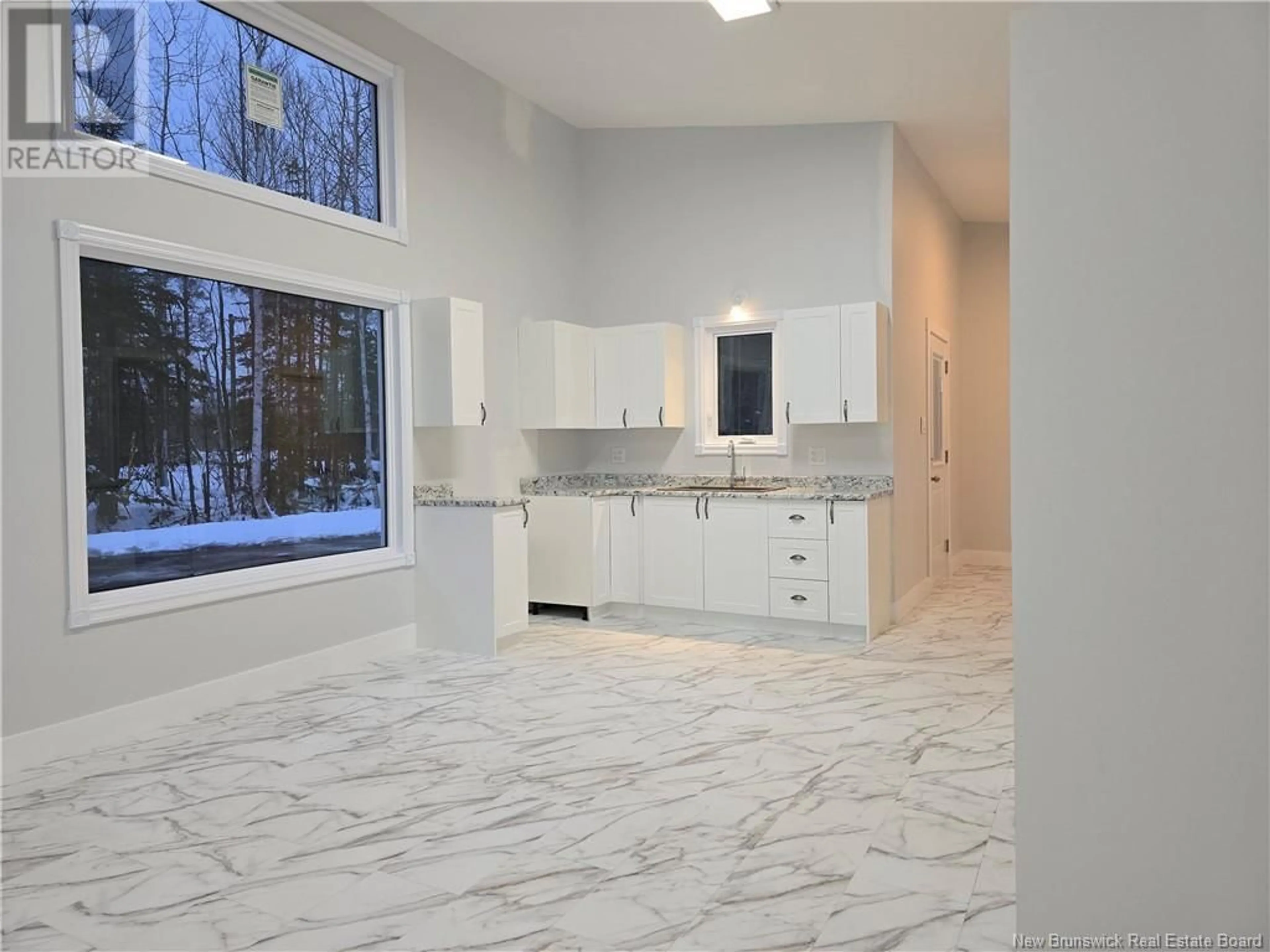 Open concept kitchen, ceramic/tile floor for 624 Rue du Portage, Caraquet New Brunswick E1W1A8