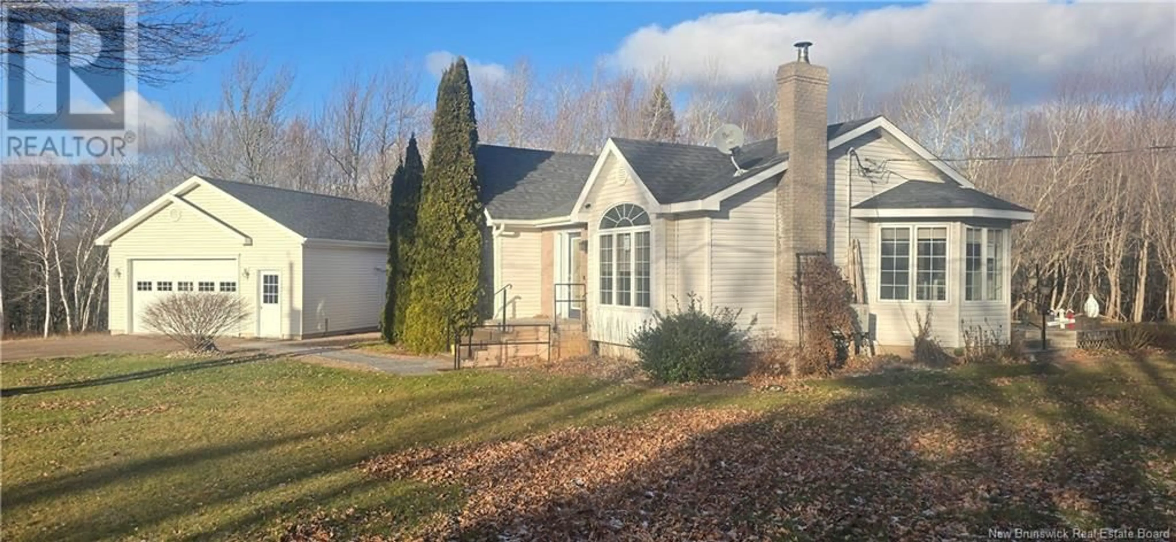 Home with vinyl exterior material, street for 61 Amedee, Cocagne New Brunswick E4R2B9