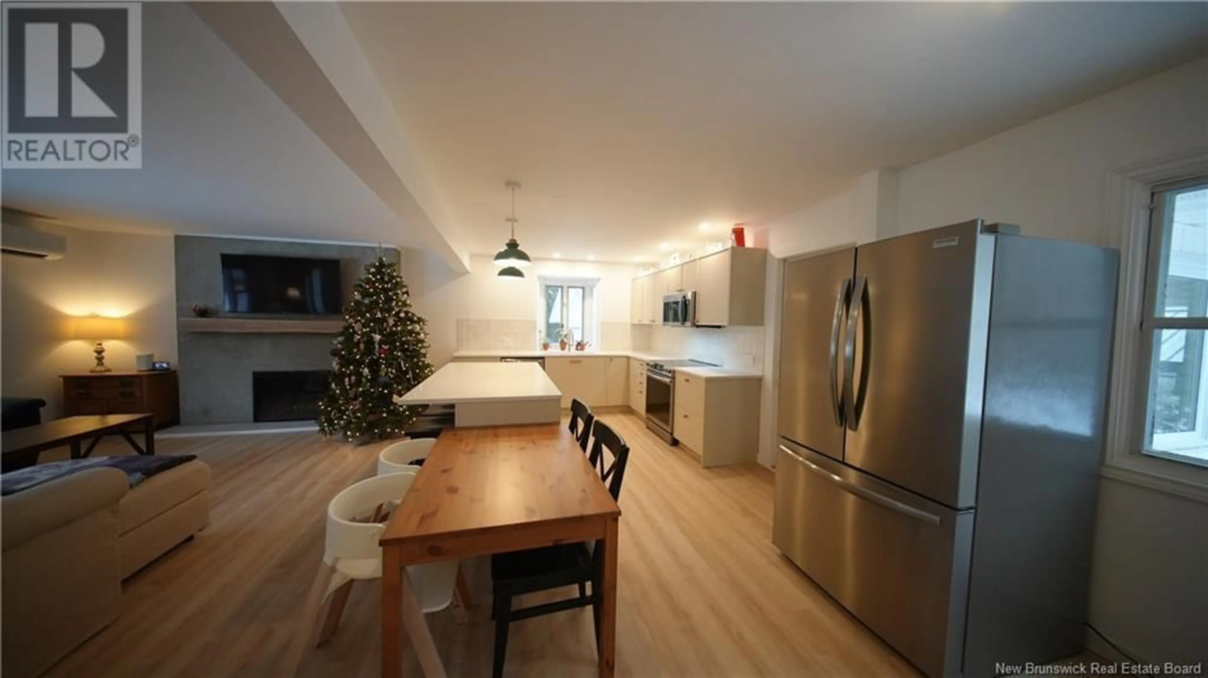 Open concept kitchen, wood/laminate floor for 906 Millidge Avenue, Saint John New Brunswick E2K2P3