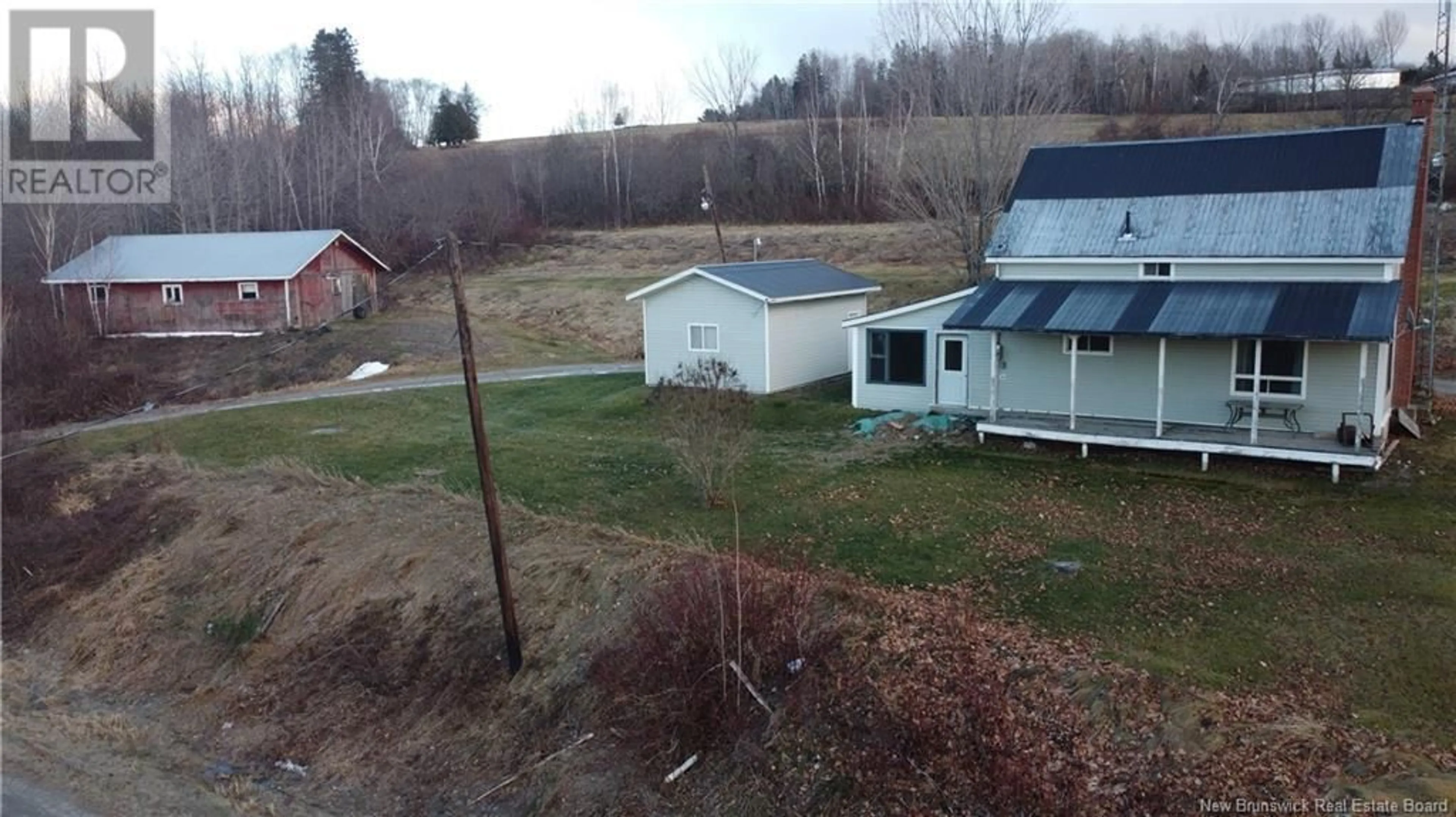 A pic from outside/outdoor area/front of a property/back of a property/a pic from drone, mountain view for 5688 105 Route, Pembroke New Brunswick E7N1T9