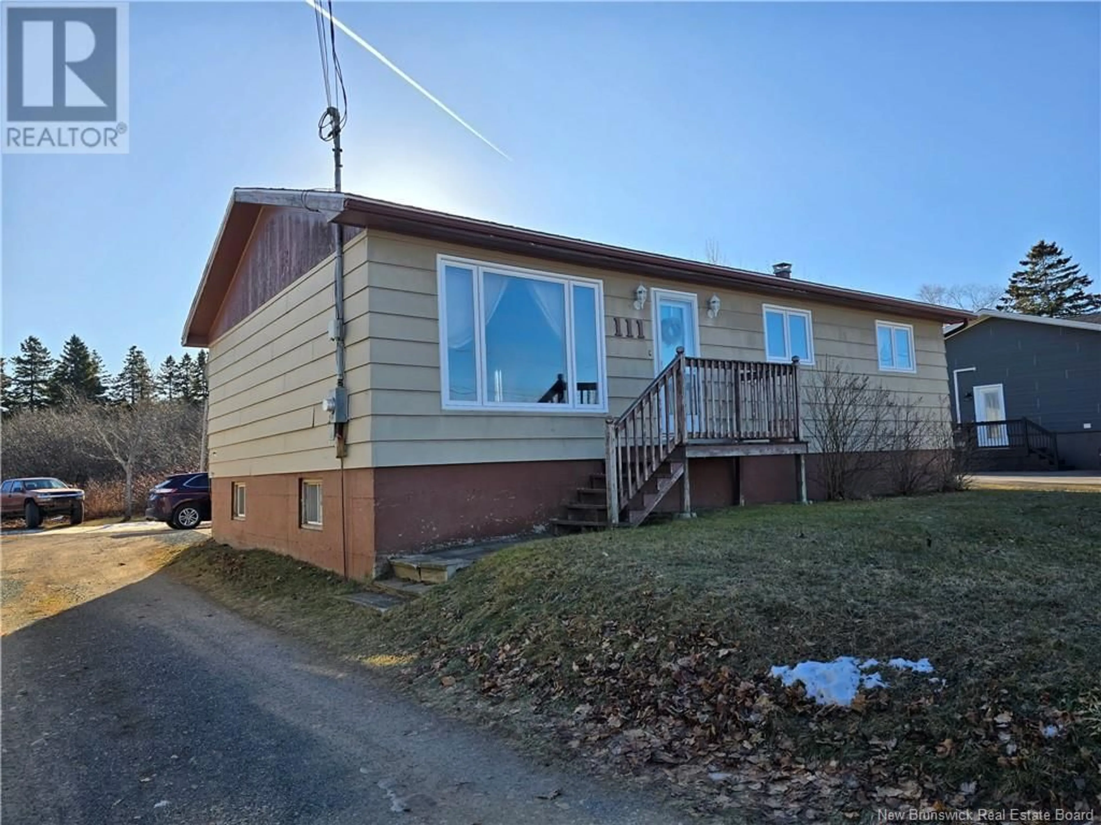 Home with vinyl exterior material, street for 111 Boudreau, Petit-Rocher New Brunswick E8J1P1