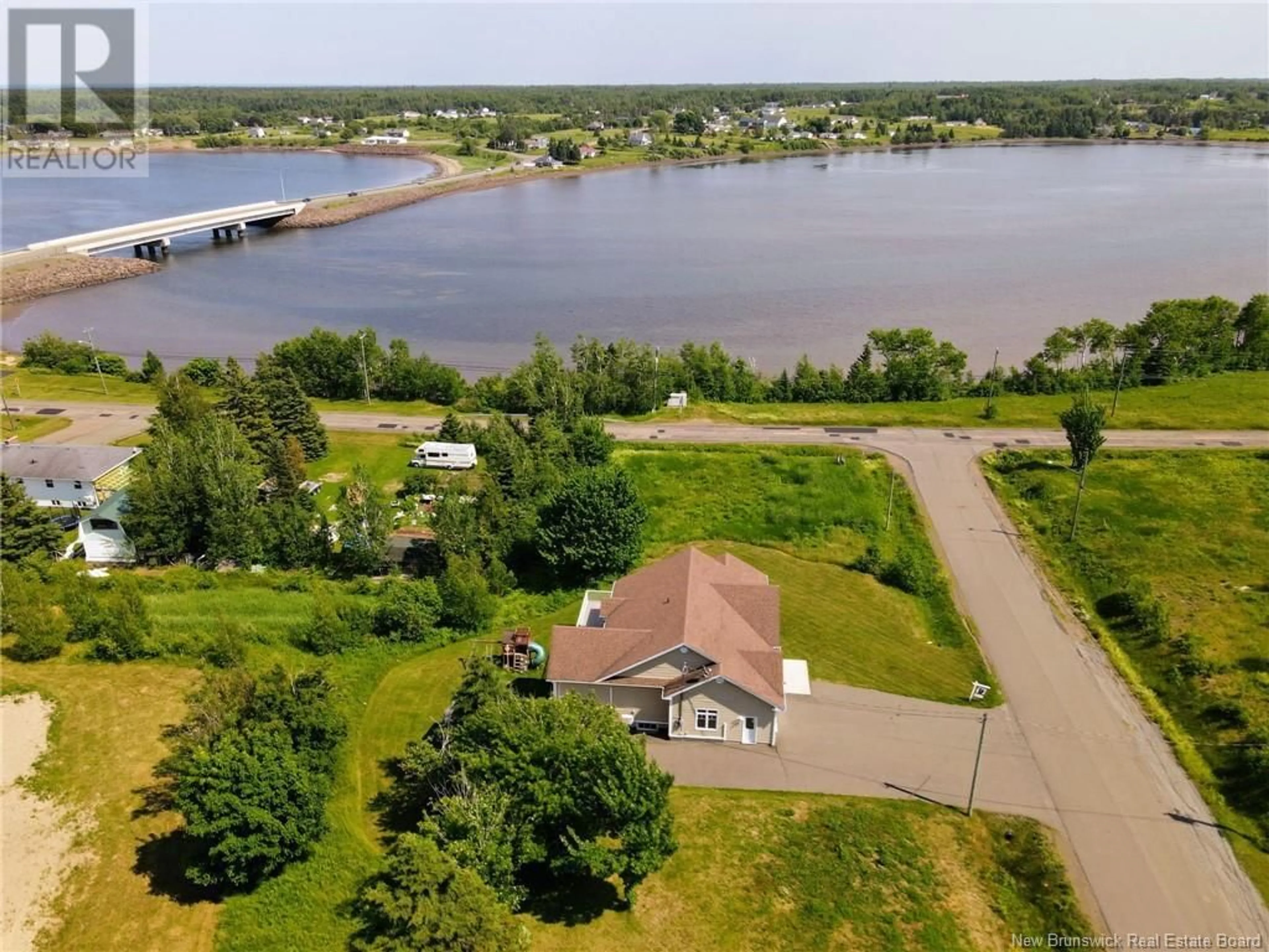 A pic from outside/outdoor area/front of a property/back of a property/a pic from drone, water/lake/river/ocean view for 9 Heron Court, Bouctouche New Brunswick E4R0A3