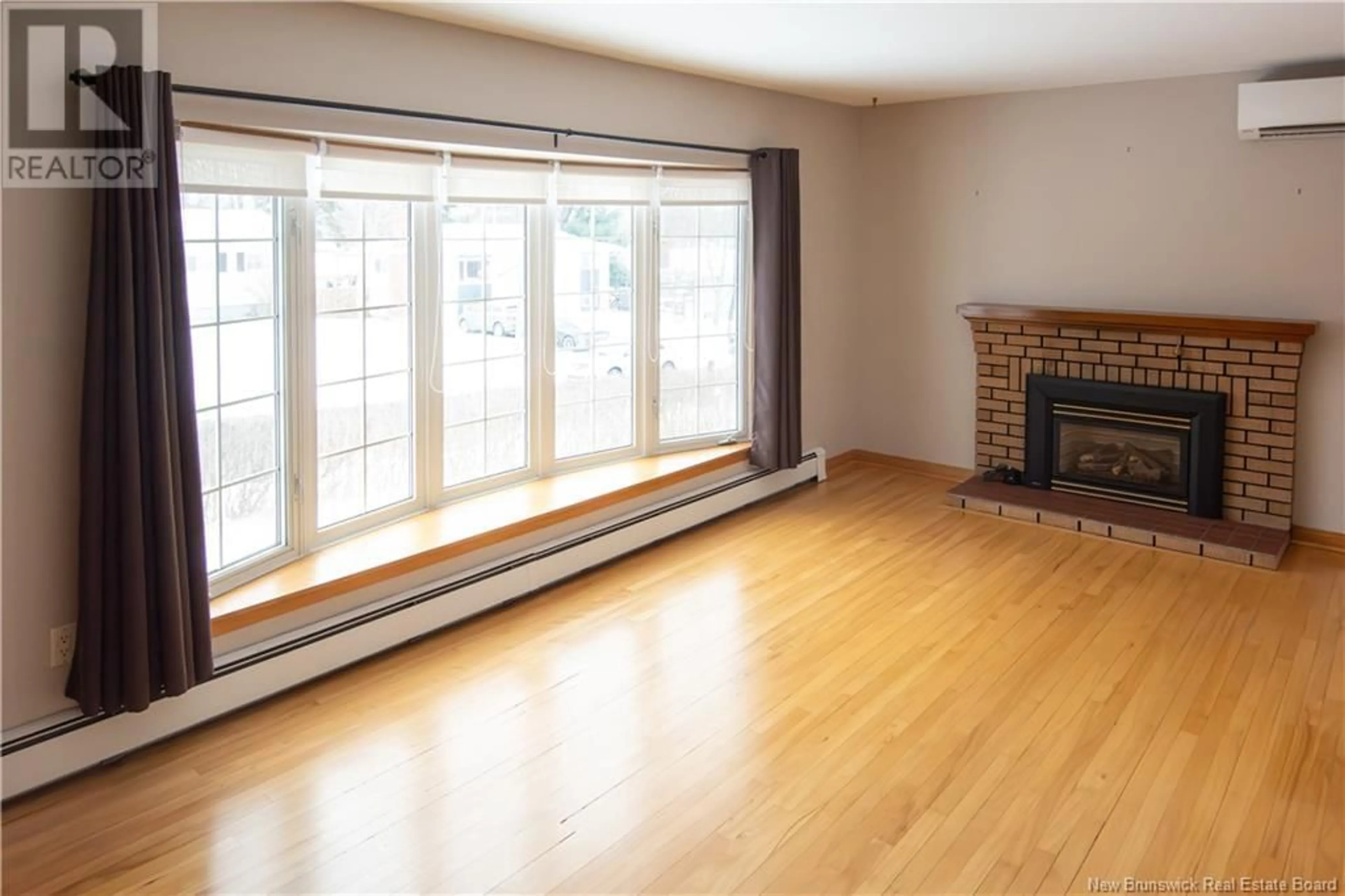 Living room with furniture, wood/laminate floor for 201 Wentworth Drive, Riverview New Brunswick E1B2T9