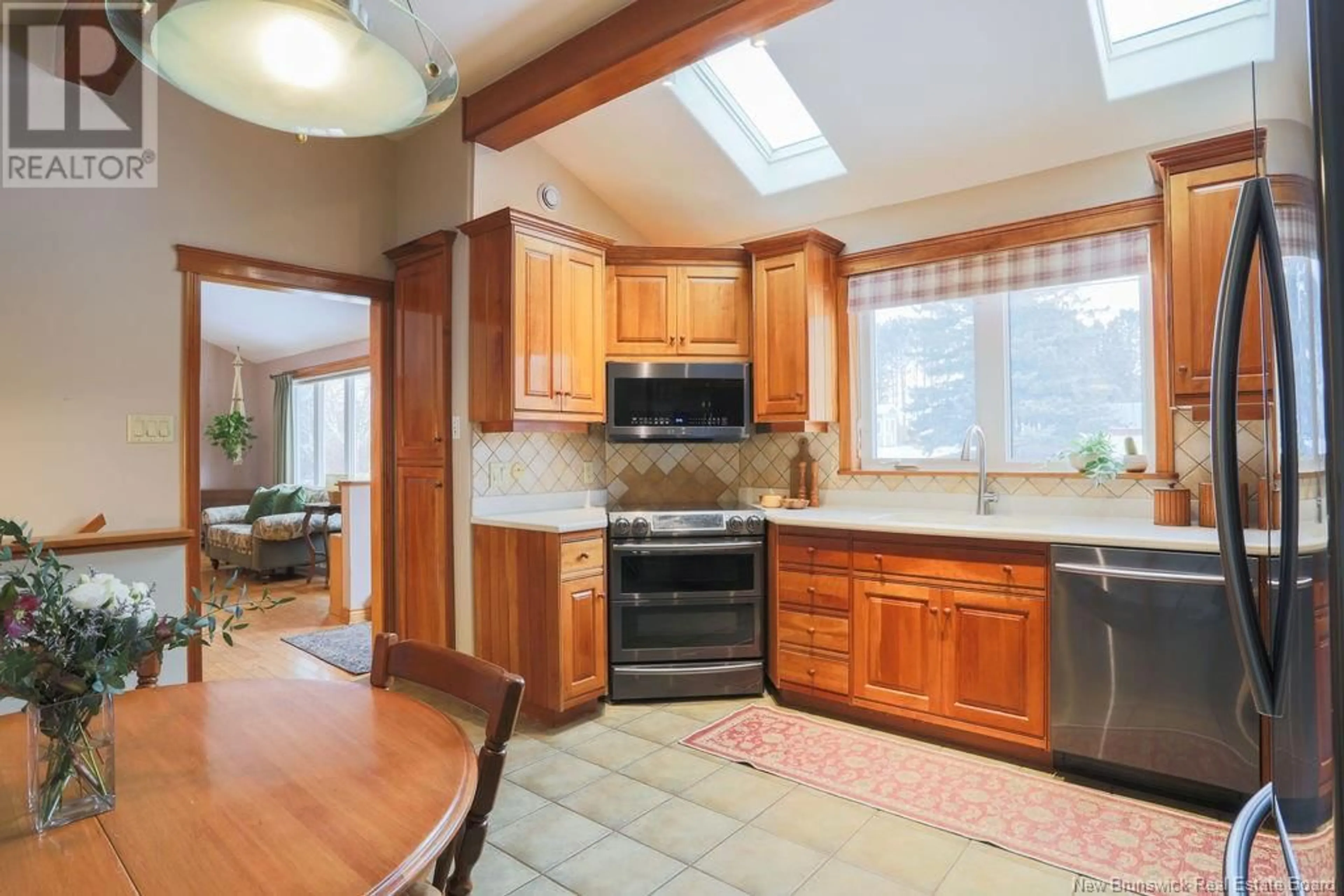 Open concept kitchen, ceramic/tile floor for 26 Valleyview Drive, Quispamsis New Brunswick E2E1N7