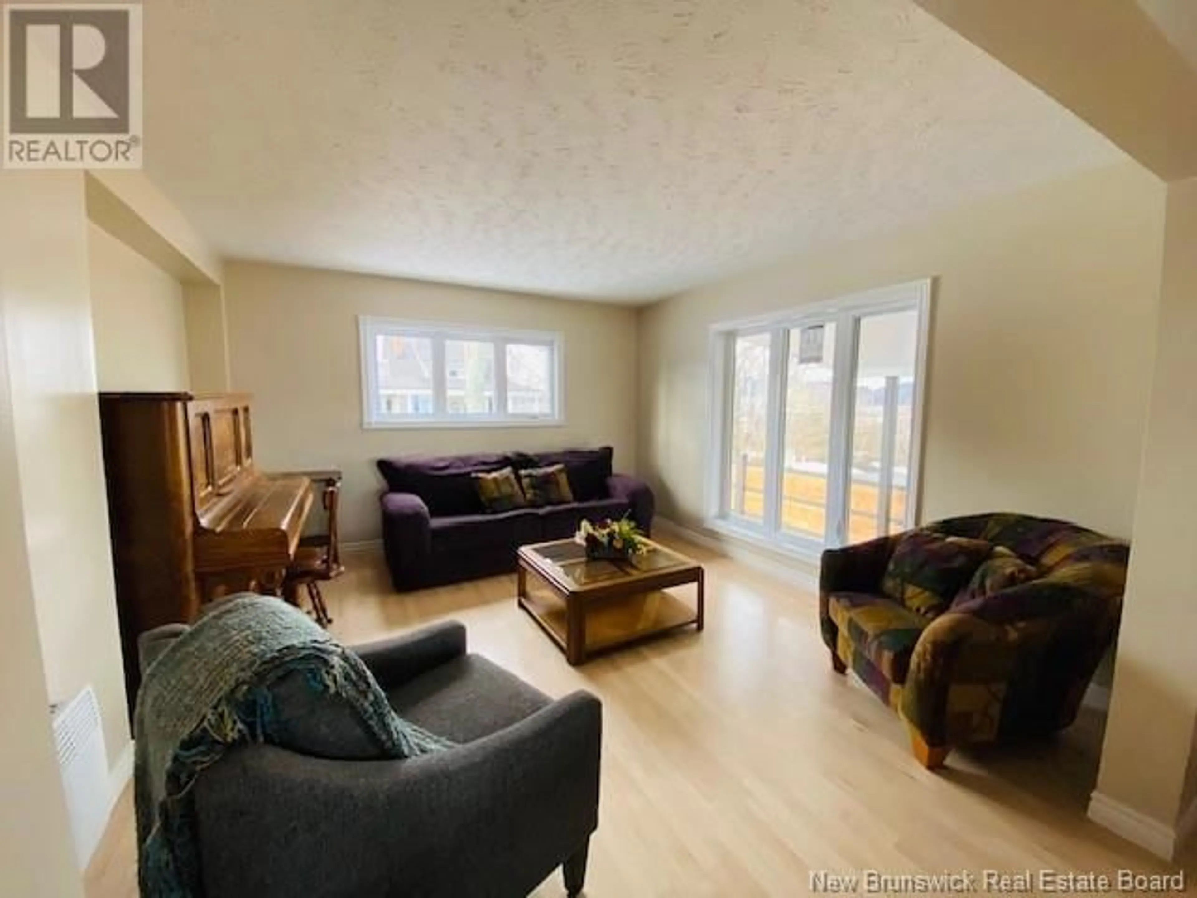 Living room with furniture, wood/laminate floor for 4 Athol Street, Campbellton New Brunswick E3N1Y3