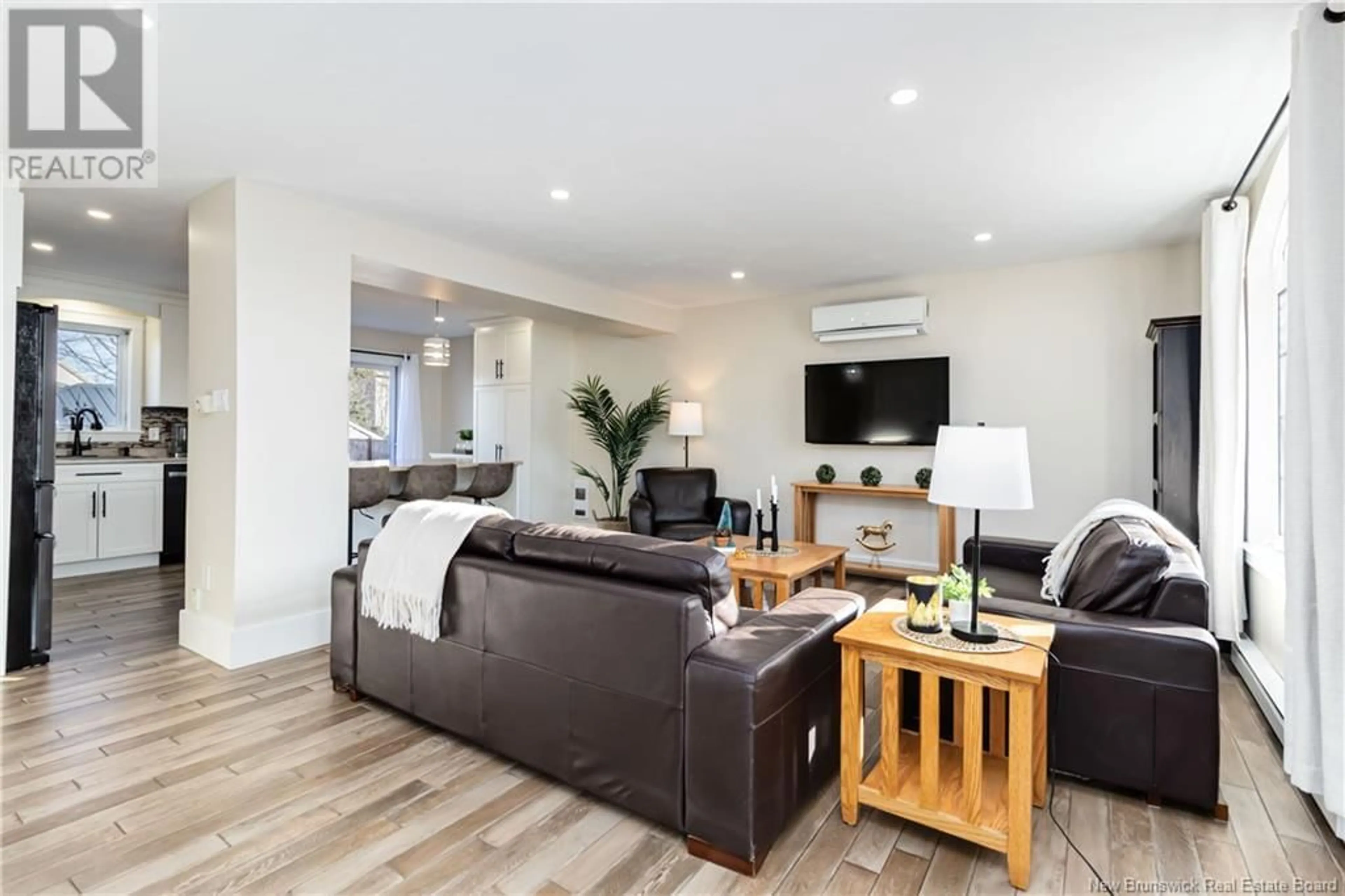 Living room with furniture, wood/laminate floor for 373 Twin Oaks Drive, Moncton New Brunswick E1G4W7