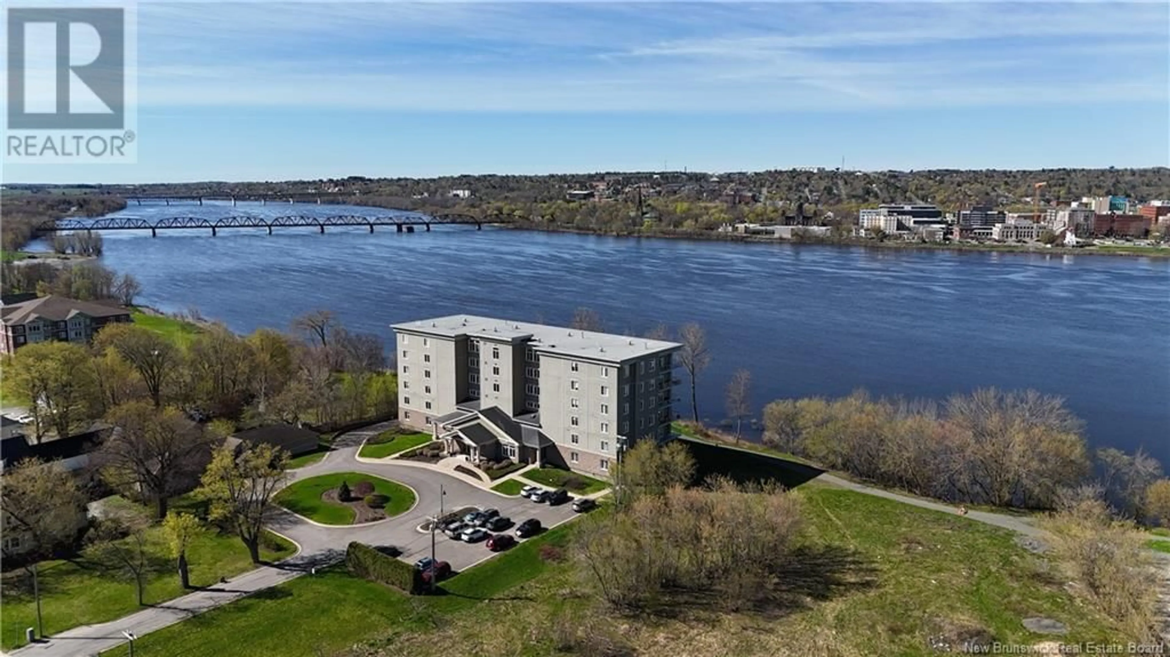 A pic from outside/outdoor area/front of a property/back of a property/a pic from drone, water/lake/river/ocean view for 104 - 1 SOUTHVIEW LANE, Fredericton New Brunswick E3A5V3