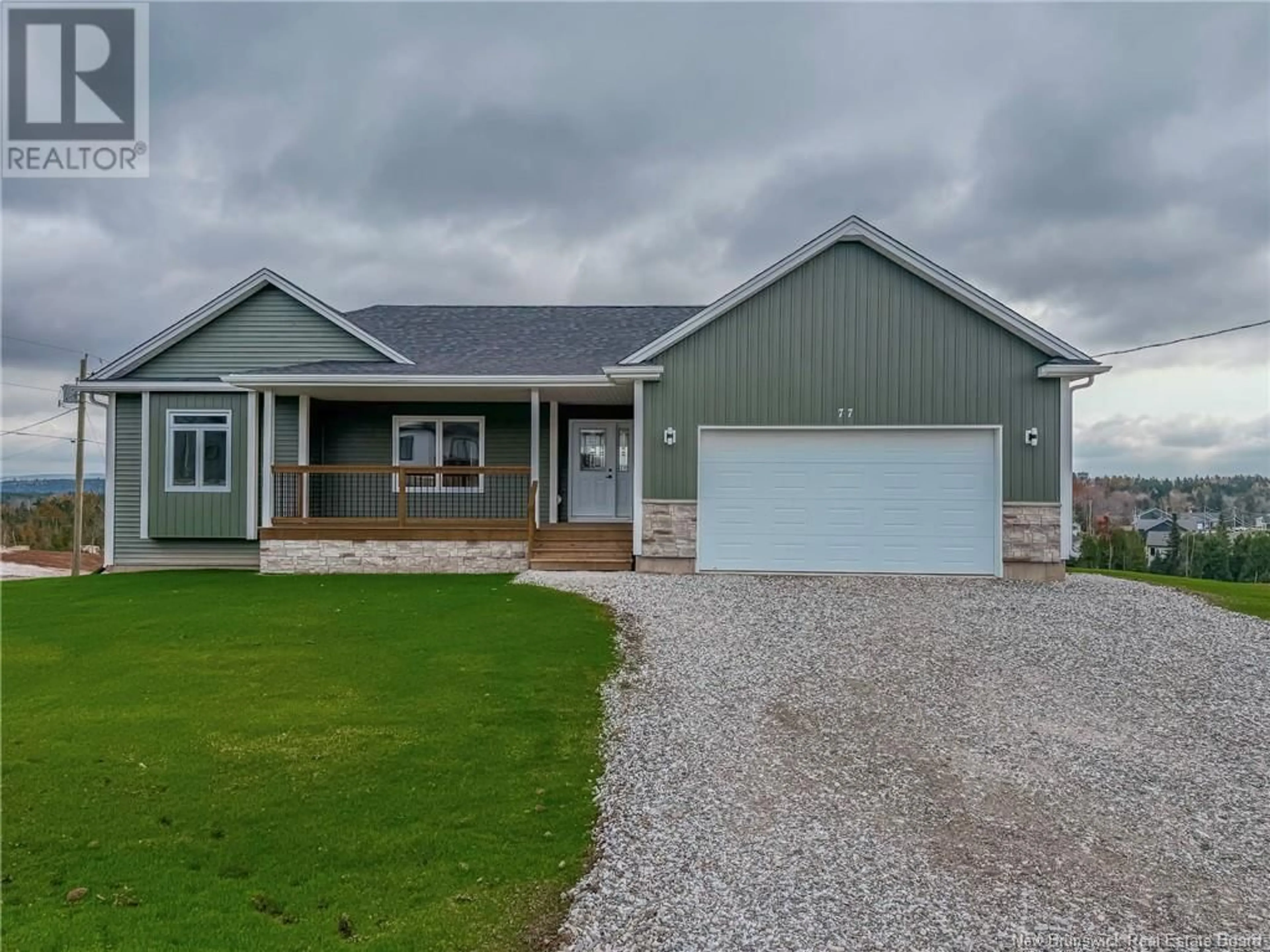 Home with vinyl exterior material, street for 77 Merlin Drive, Quispamsis New Brunswick E2E0Y3