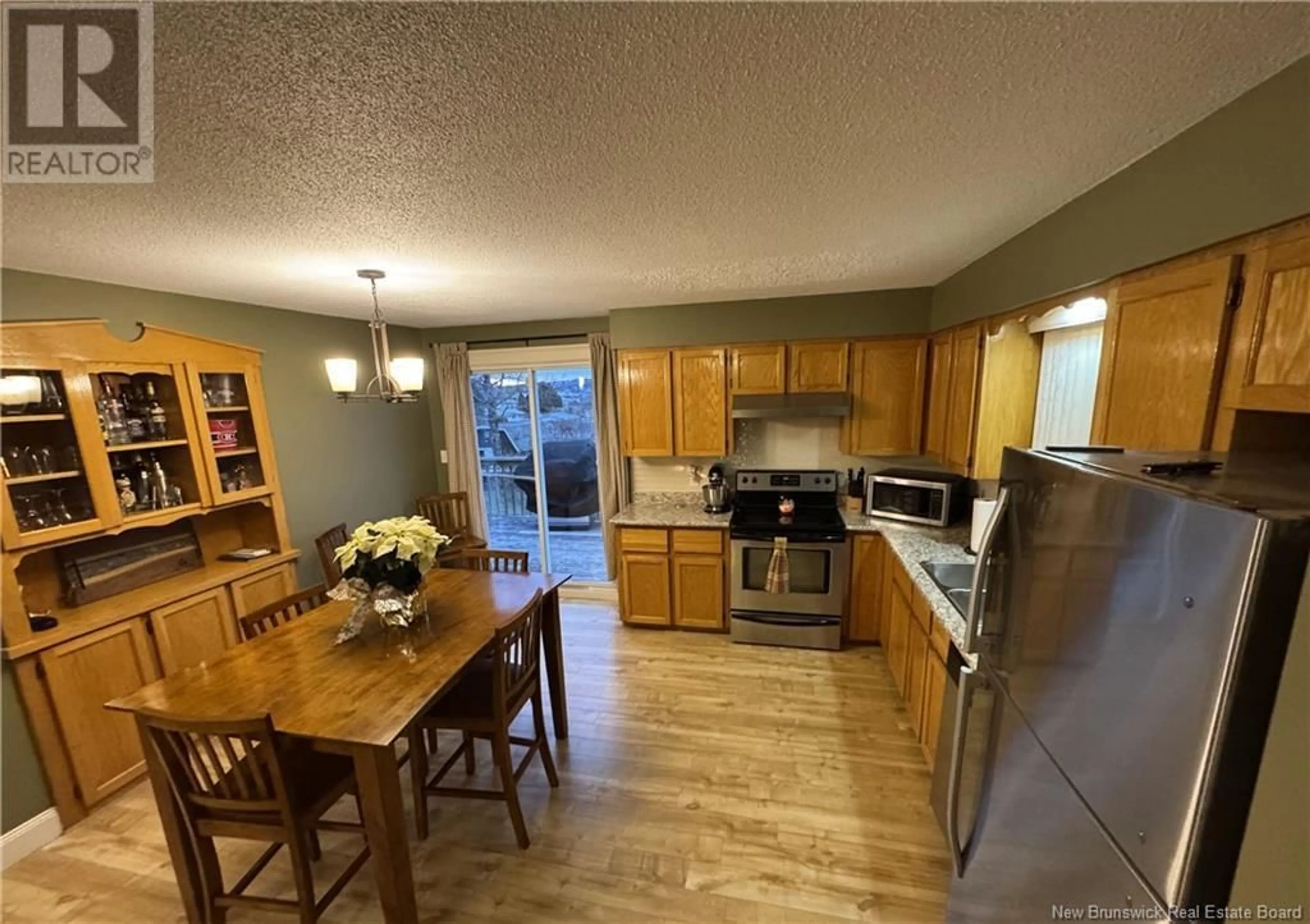 Open concept kitchen, wood/laminate floor for 357 Guay Street, Grand-Sault/Grand Falls New Brunswick E3Y1E4