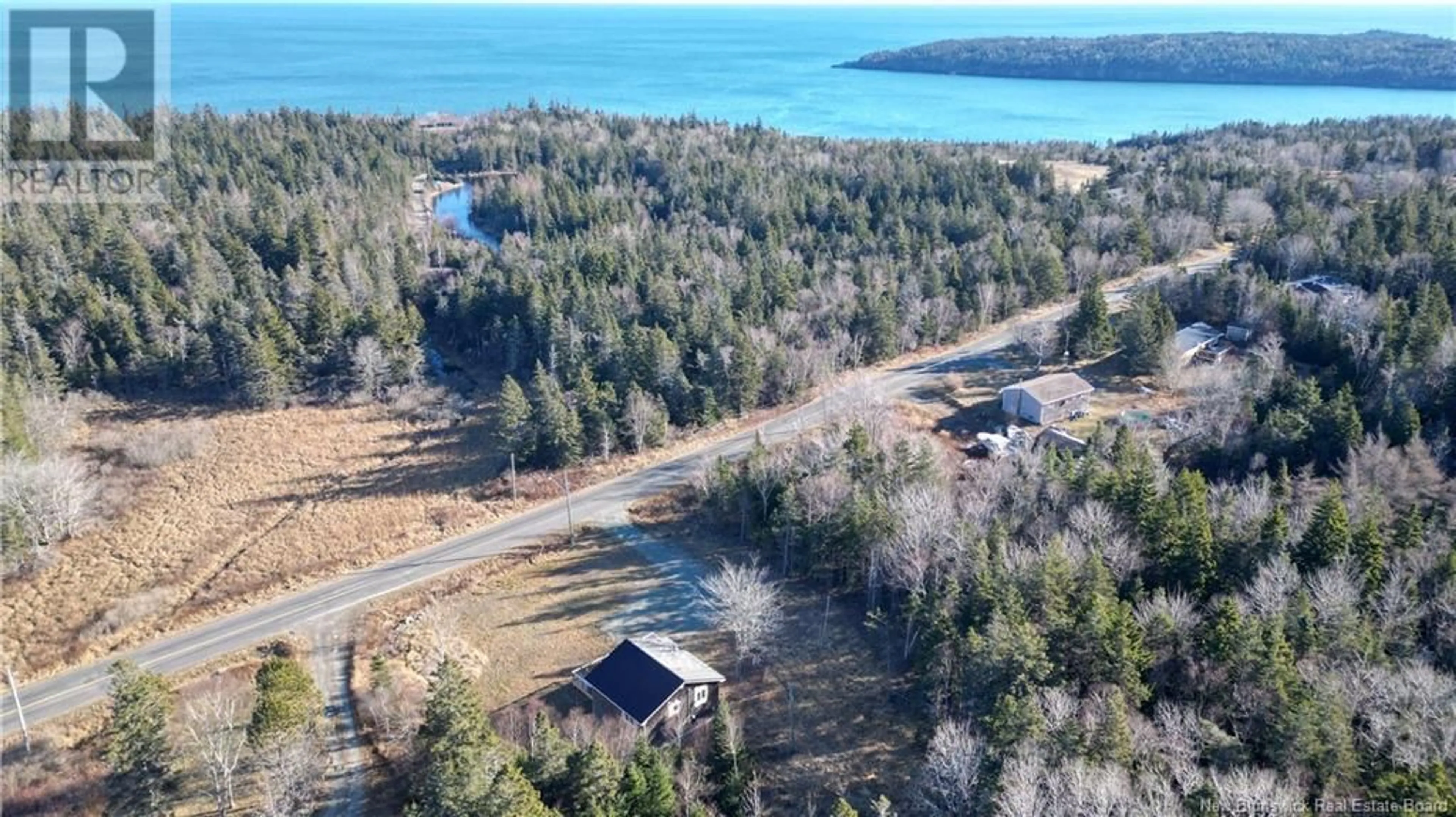 A pic from outside/outdoor area/front of a property/back of a property/a pic from drone, water/lake/river/ocean view for 235 Whistle Road, Grand Manan New Brunswick E5G1B4