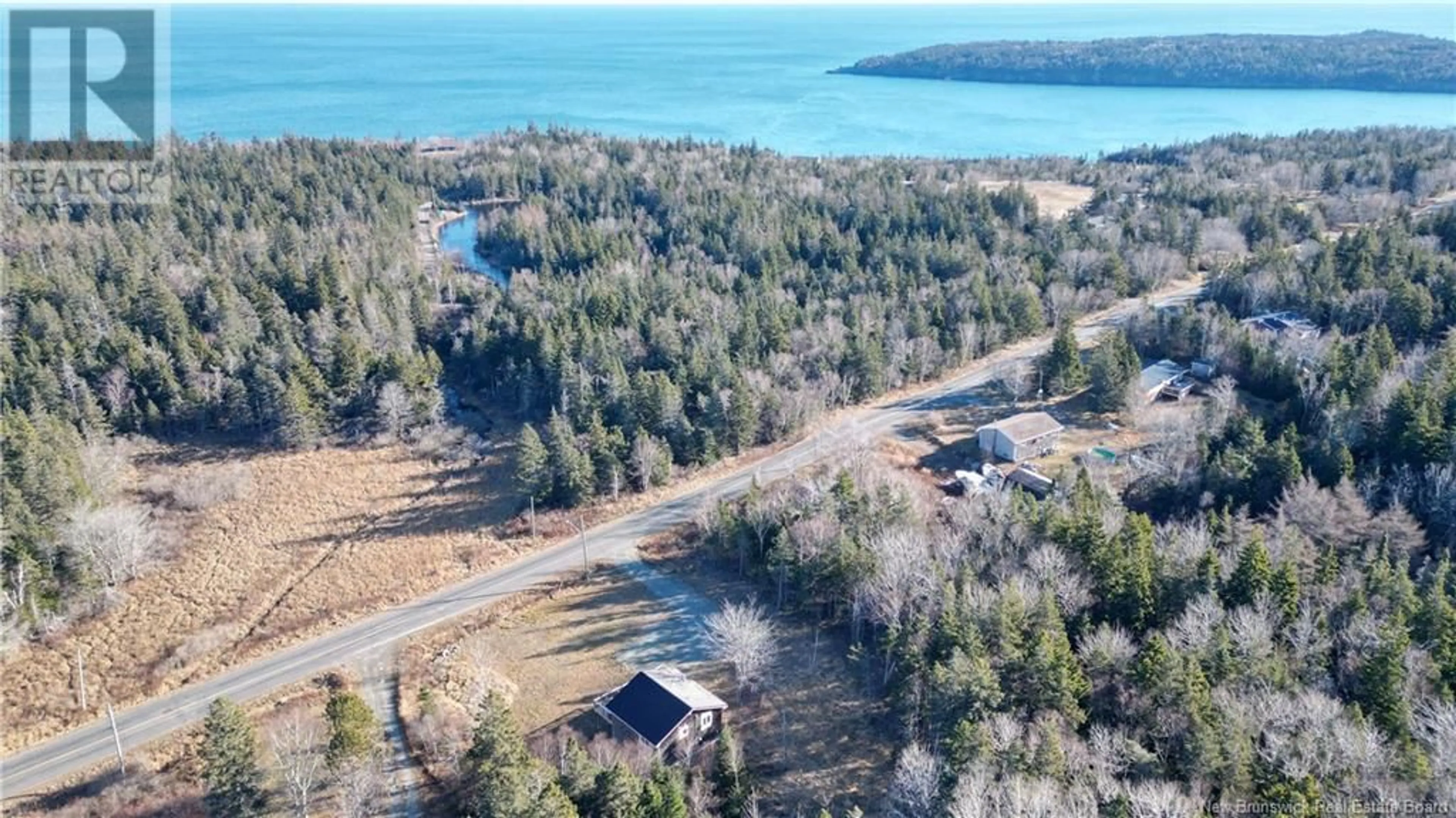 A pic from outside/outdoor area/front of a property/back of a property/a pic from drone, water/lake/river/ocean view for 235 Whistle Road, Grand Manan New Brunswick E5G1B4