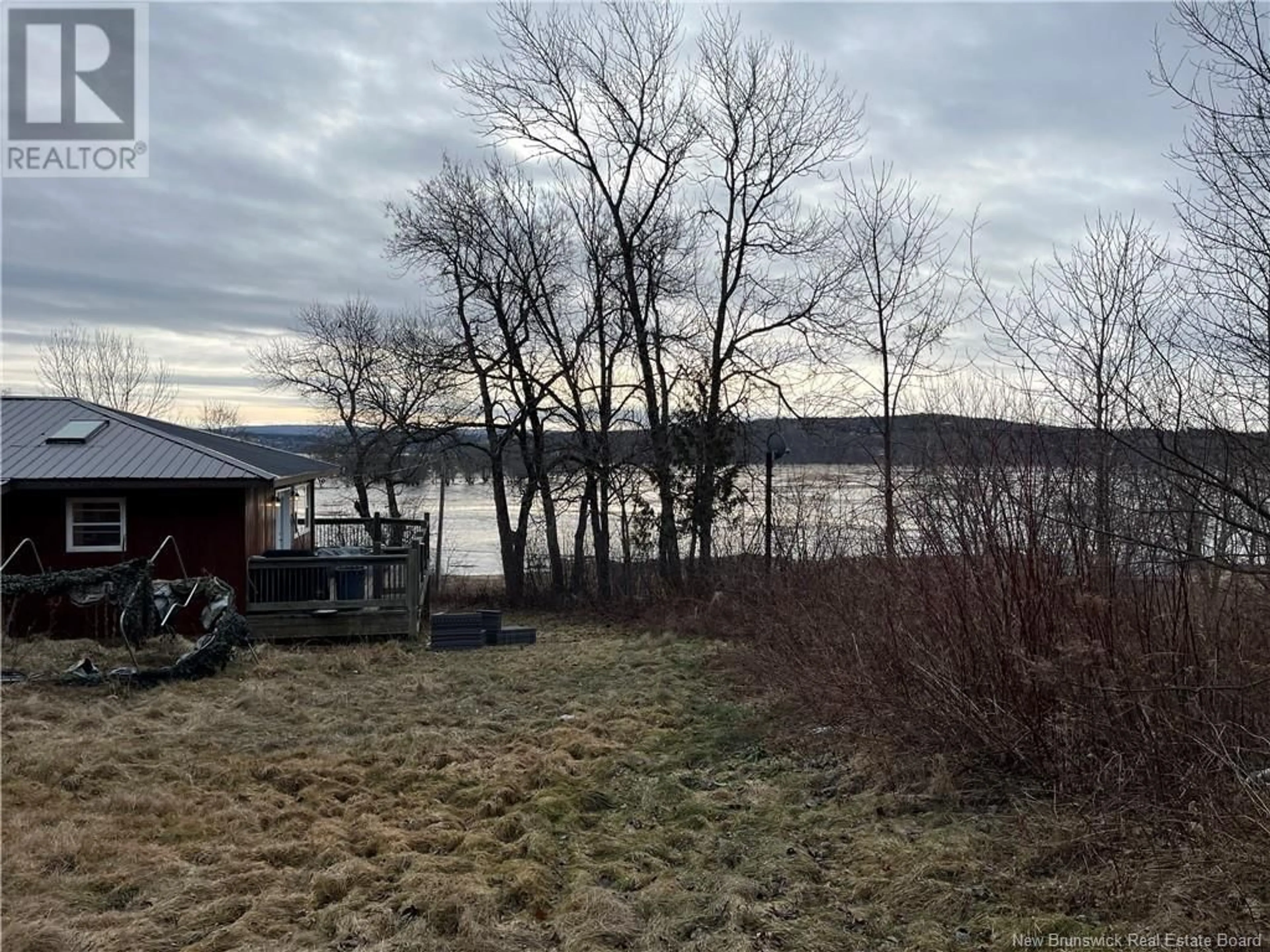 A pic from outside/outdoor area/front of a property/back of a property/a pic from drone, water/lake/river/ocean view for 116 Norton Shore Road, Hampton New Brunswick E2N6J8