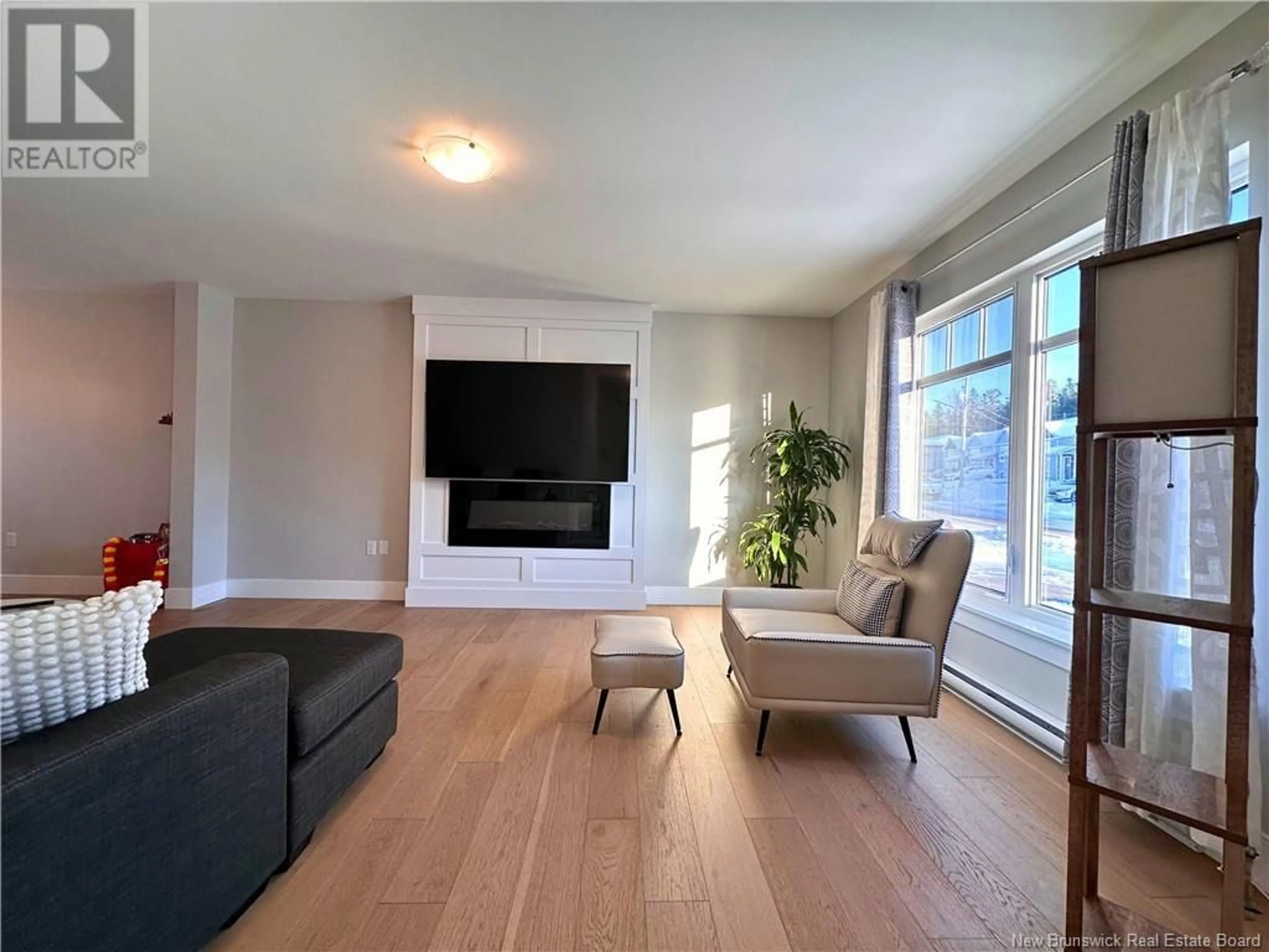 Living room with furniture, wood/laminate floor for 194 Rue Des Erables, Dieppe New Brunswick E1A9B2