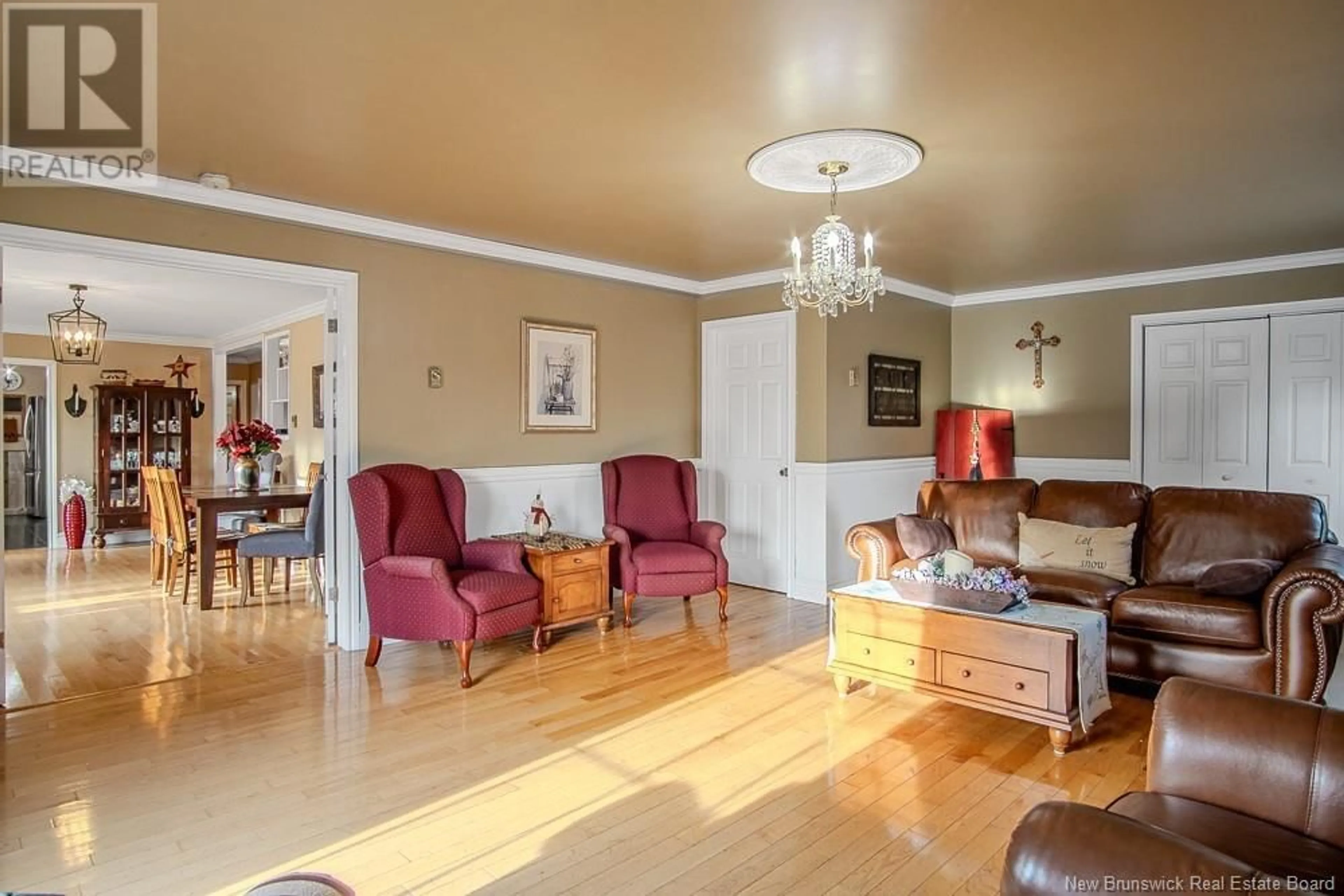 Living room with furniture, wood/laminate floor for 2511 Loch Lomond Road, Saint John New Brunswick E2N1A5