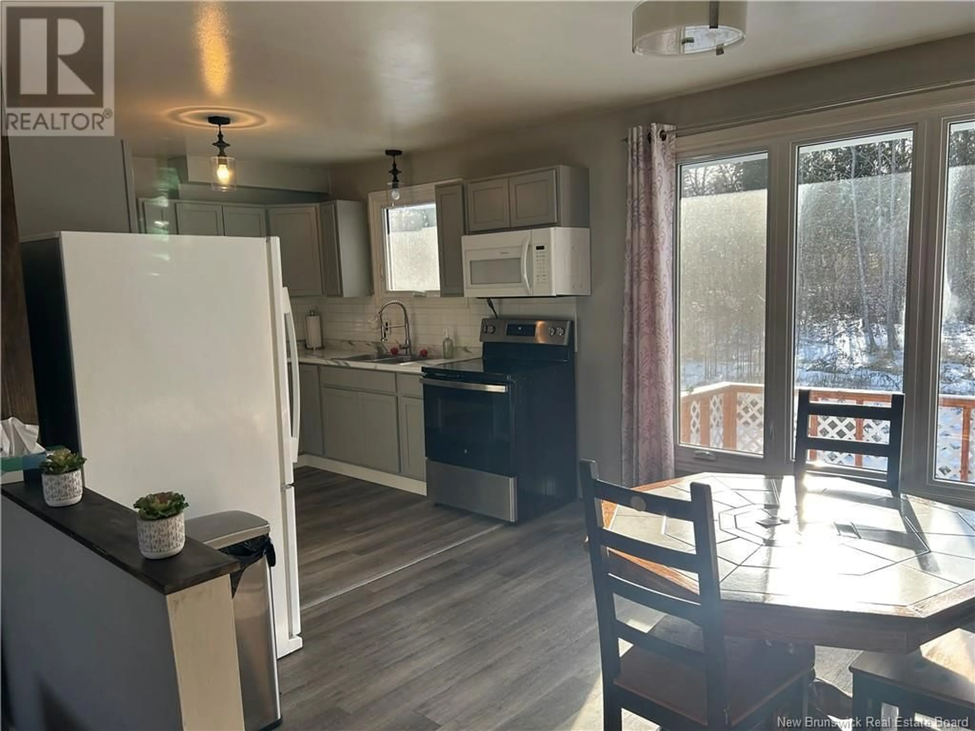 Open concept kitchen, wood/laminate floor for 46 Chaleur, Belledune New Brunswick E8G1Z4