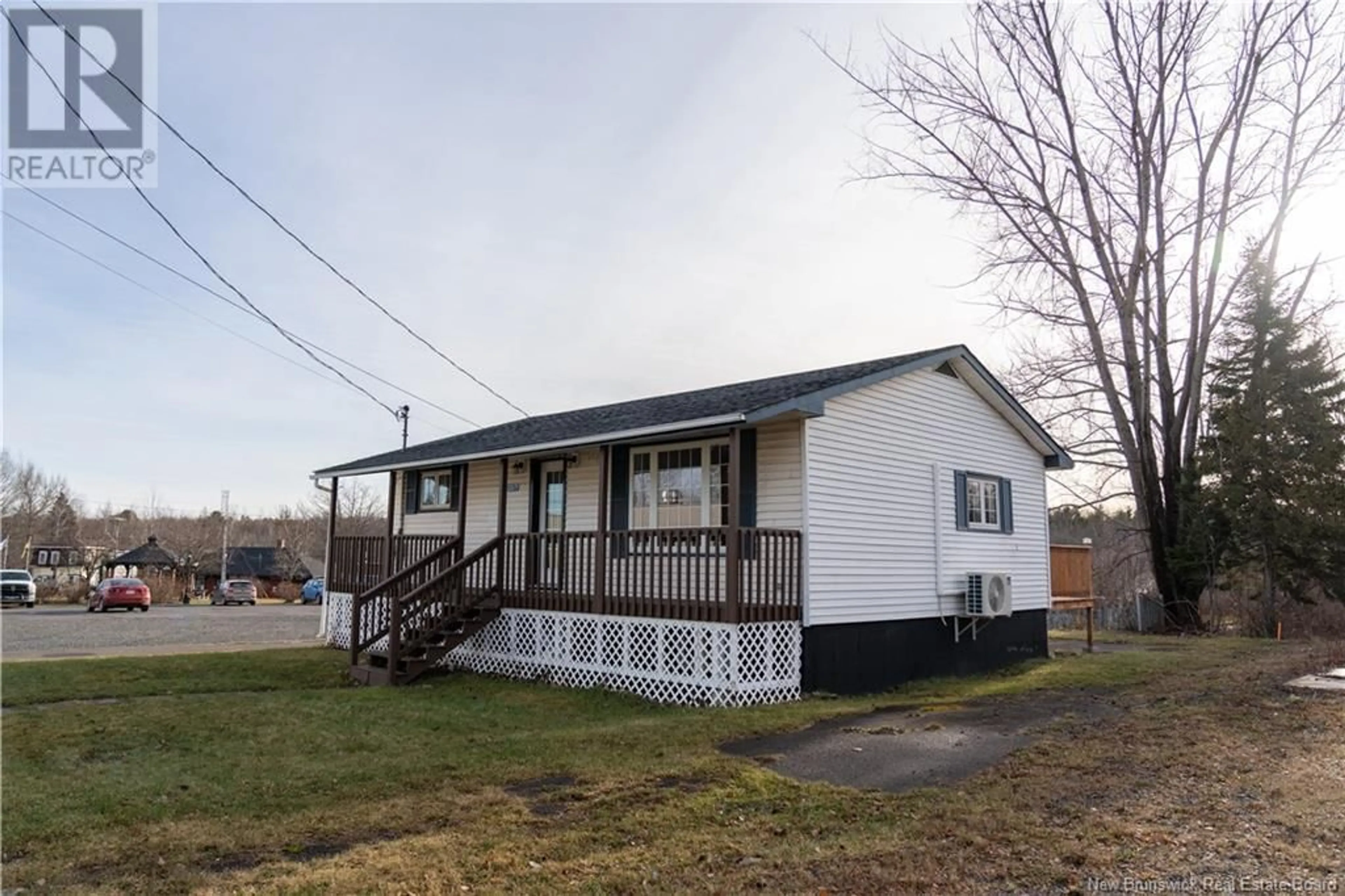 Home with vinyl exterior material, street for 203 Main Street, Minto New Brunswick E4B3N4