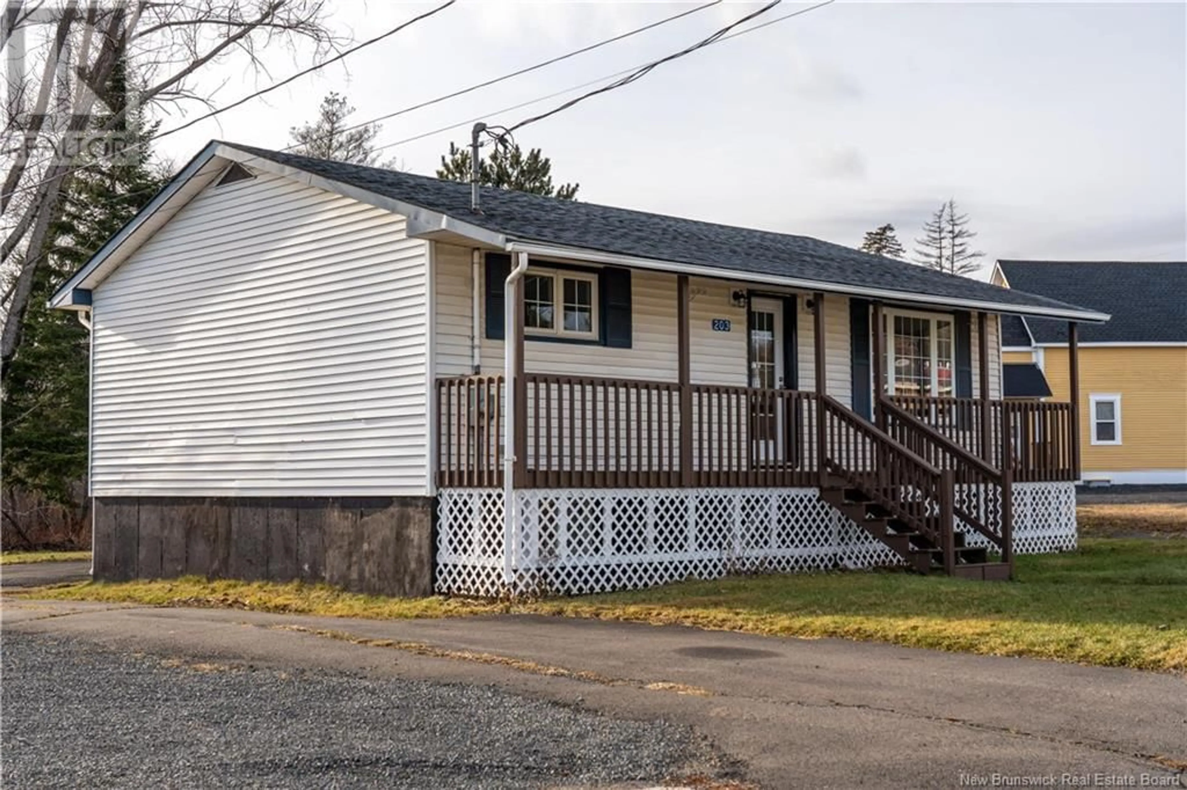 Home with vinyl exterior material, street for 203 Main Street, Minto New Brunswick E4B3N4