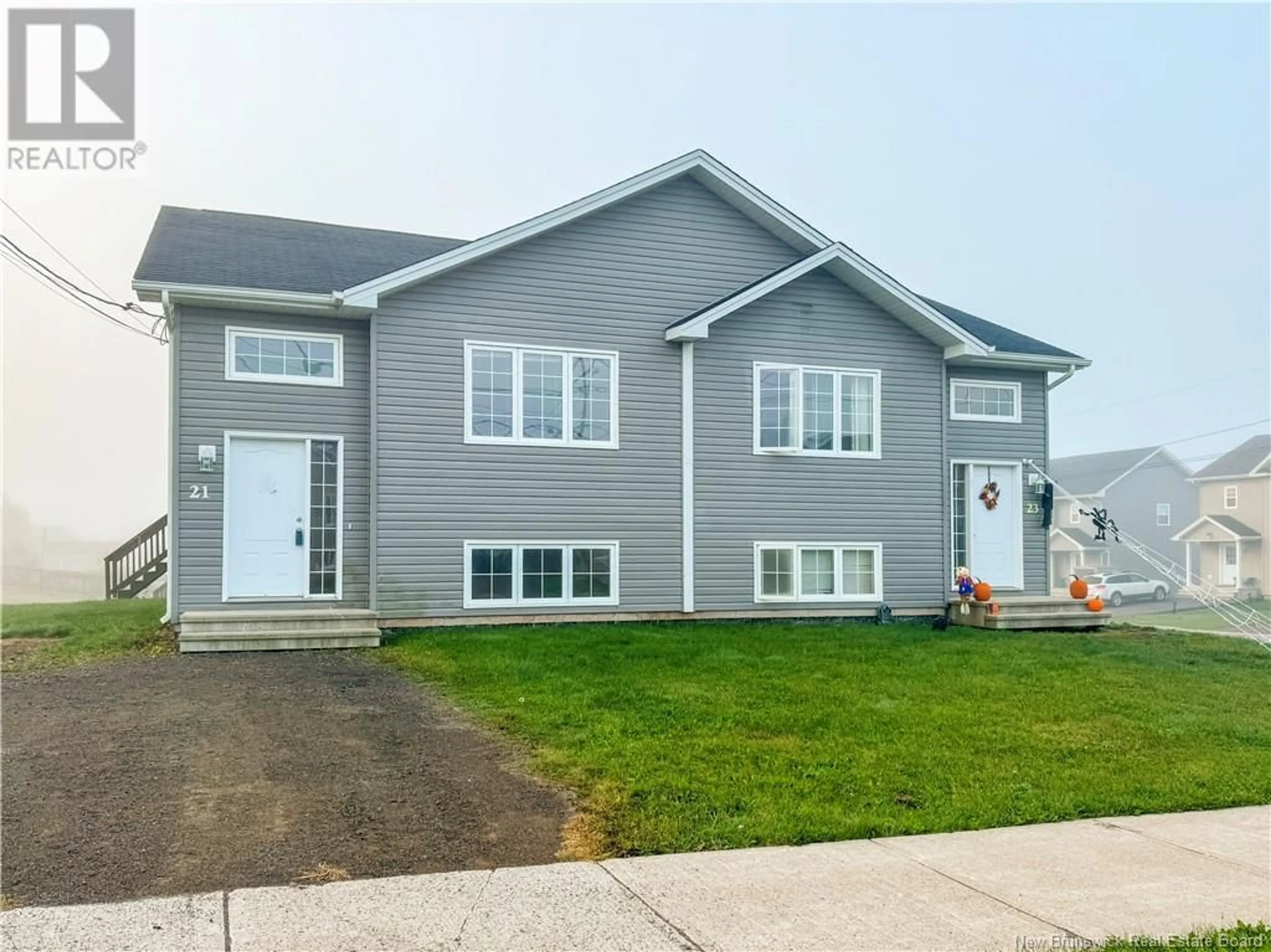 Home with vinyl exterior material, street for 21 Edington Street, Moncton New Brunswick E1A5M7