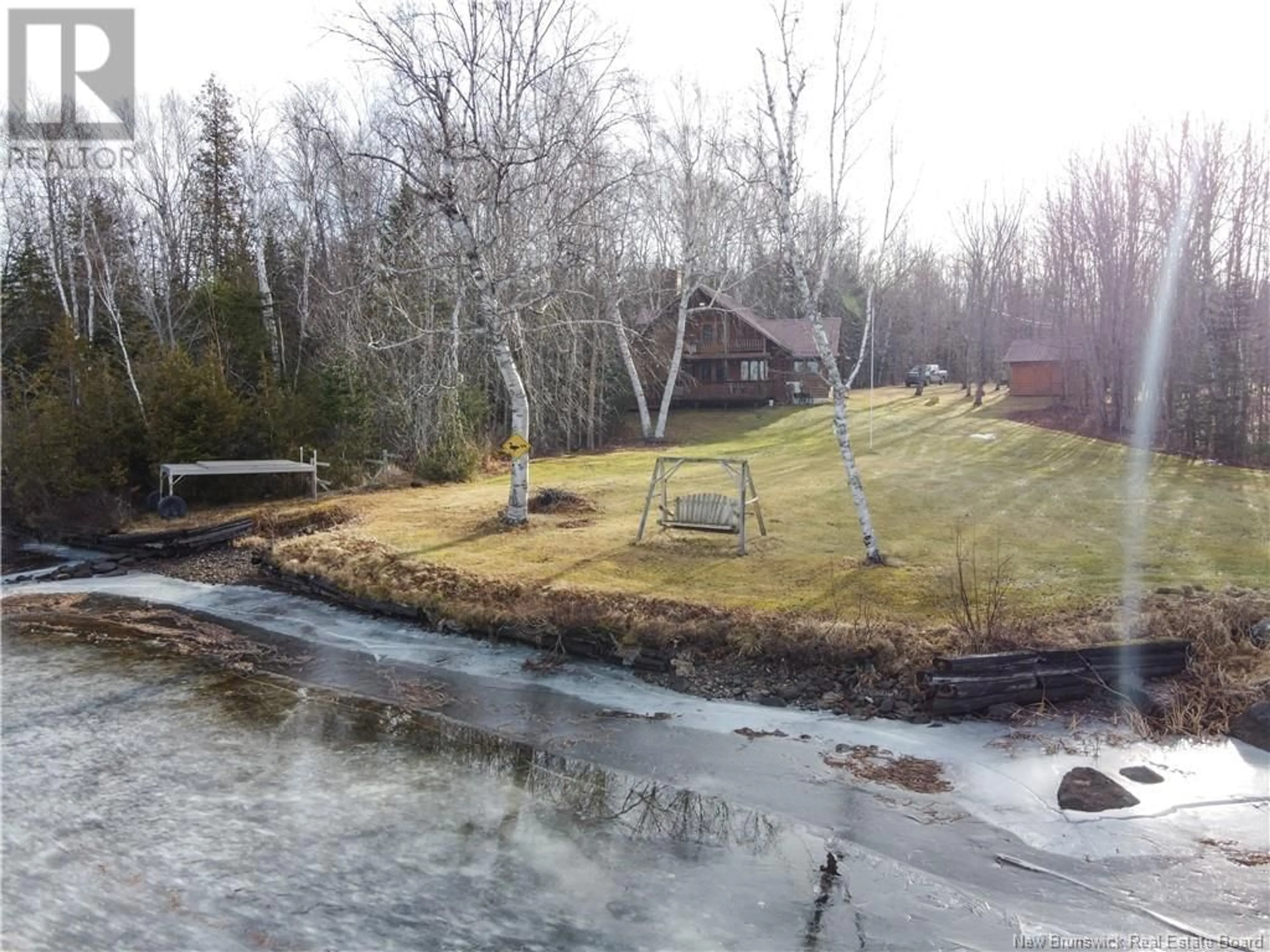 A pic from outside/outdoor area/front of a property/back of a property/a pic from drone, water/lake/river/ocean view for 7 Taint Lane, Fosterville New Brunswick E6H2G4