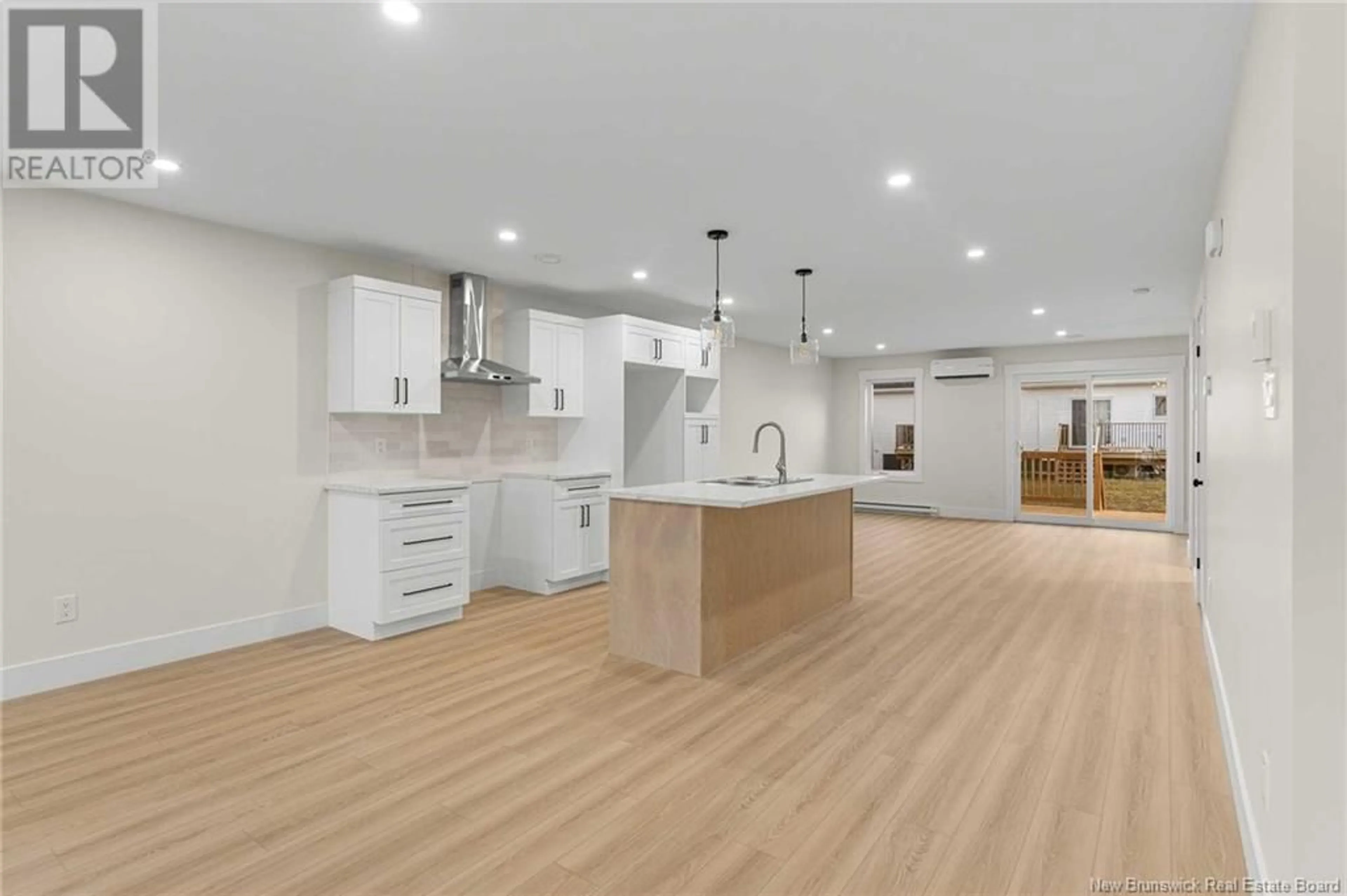 Open concept kitchen, wood/laminate floor for 158 Ernest Street, Dieppe New Brunswick E1A4T2