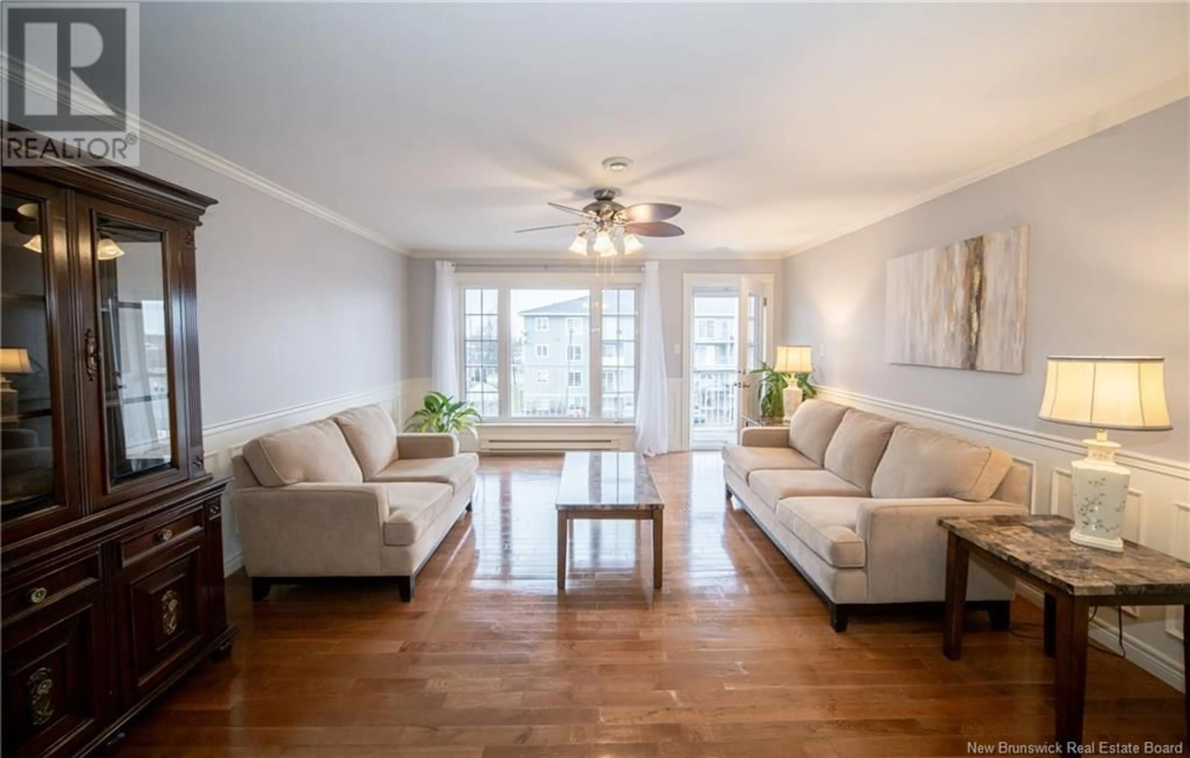 Living room with furniture, wood/laminate floor for 35 Lian Street Unit# 8, Fredericton New Brunswick E3C0A2