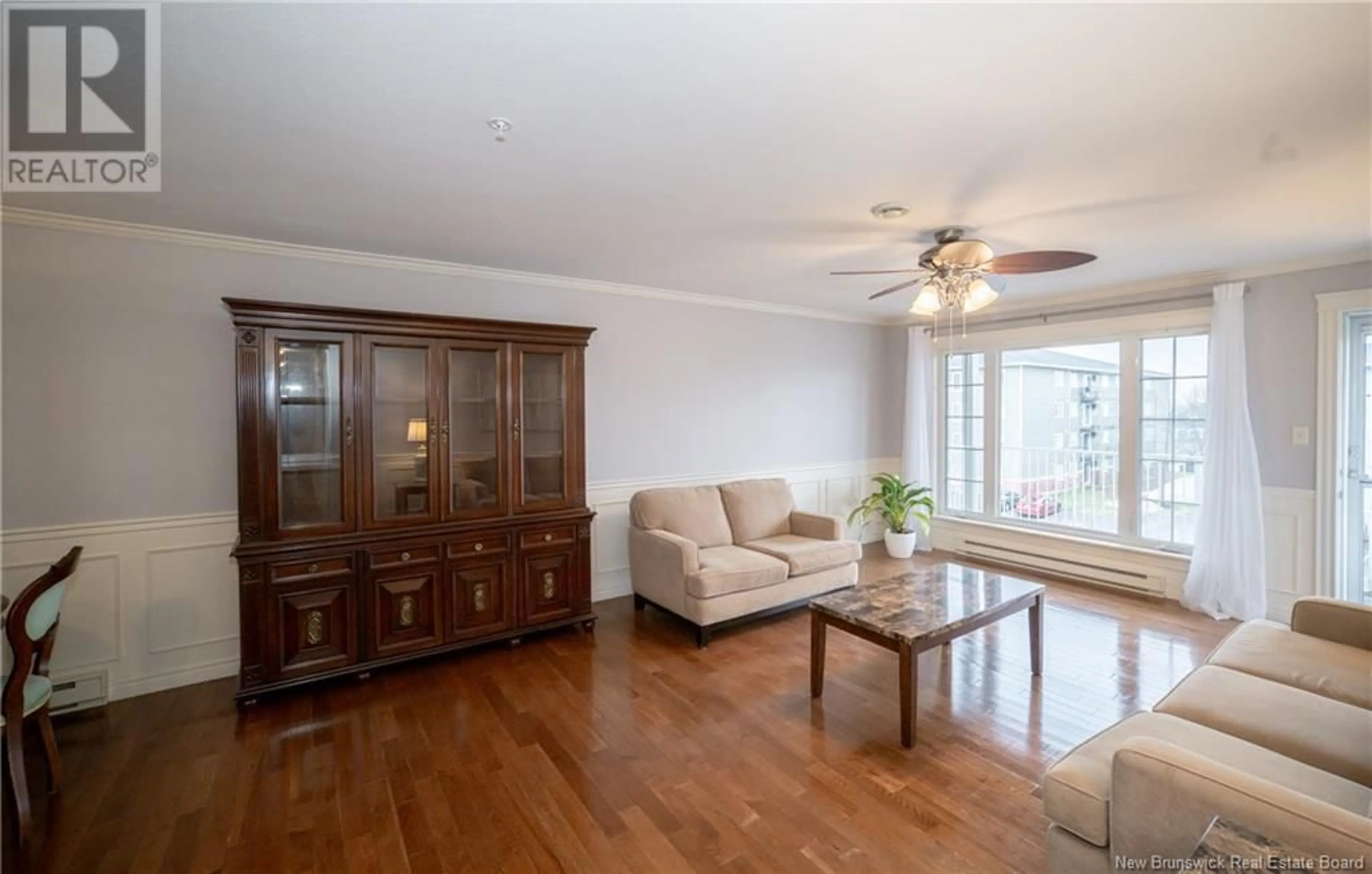 Living room with furniture, wood/laminate floor for 35 Lian Street Unit# 8, Fredericton New Brunswick E3C0A2