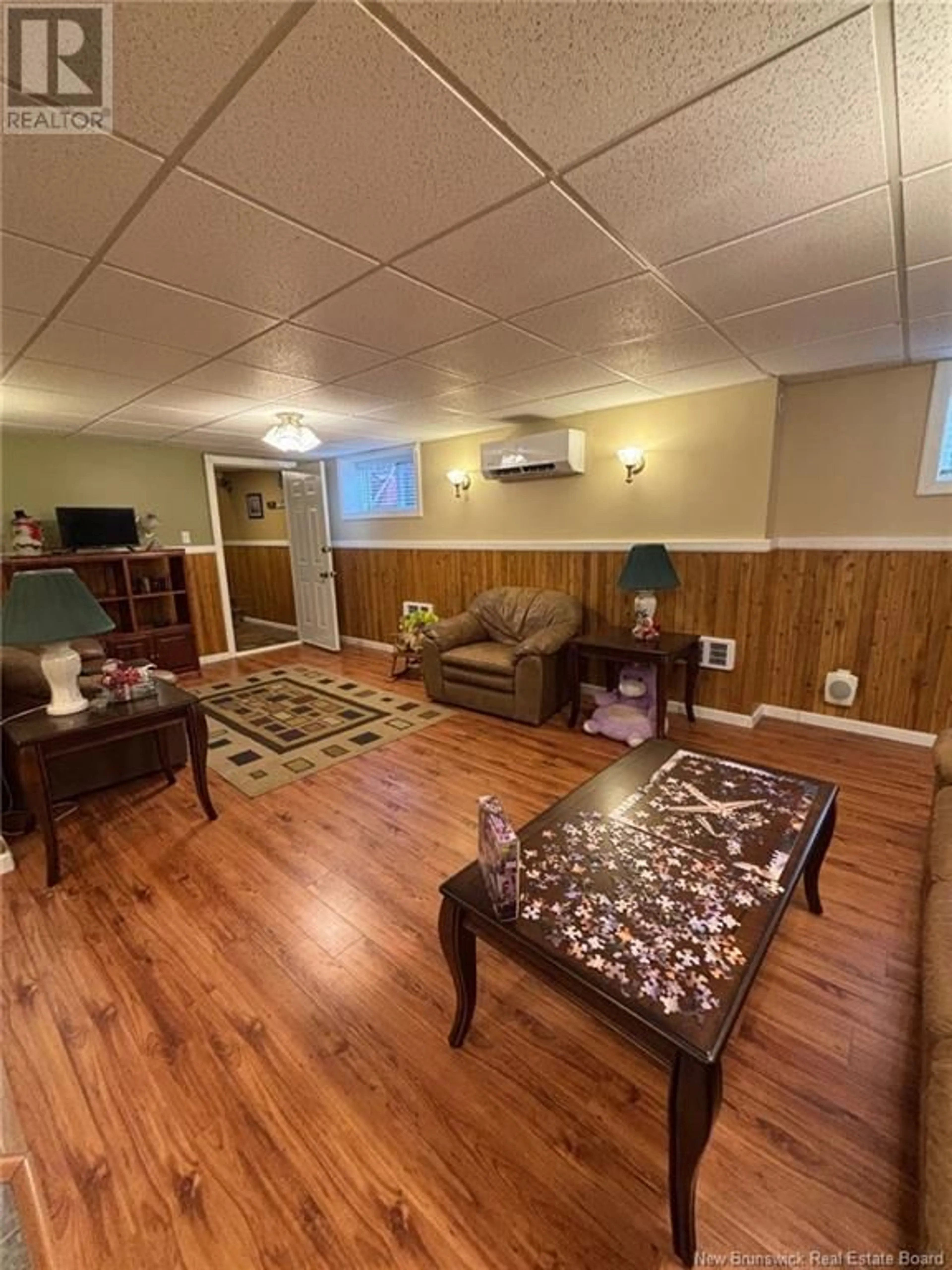 Living room with furniture, wood/laminate floor for 19 McKnight Road, Moores Mills New Brunswick E3L4V4