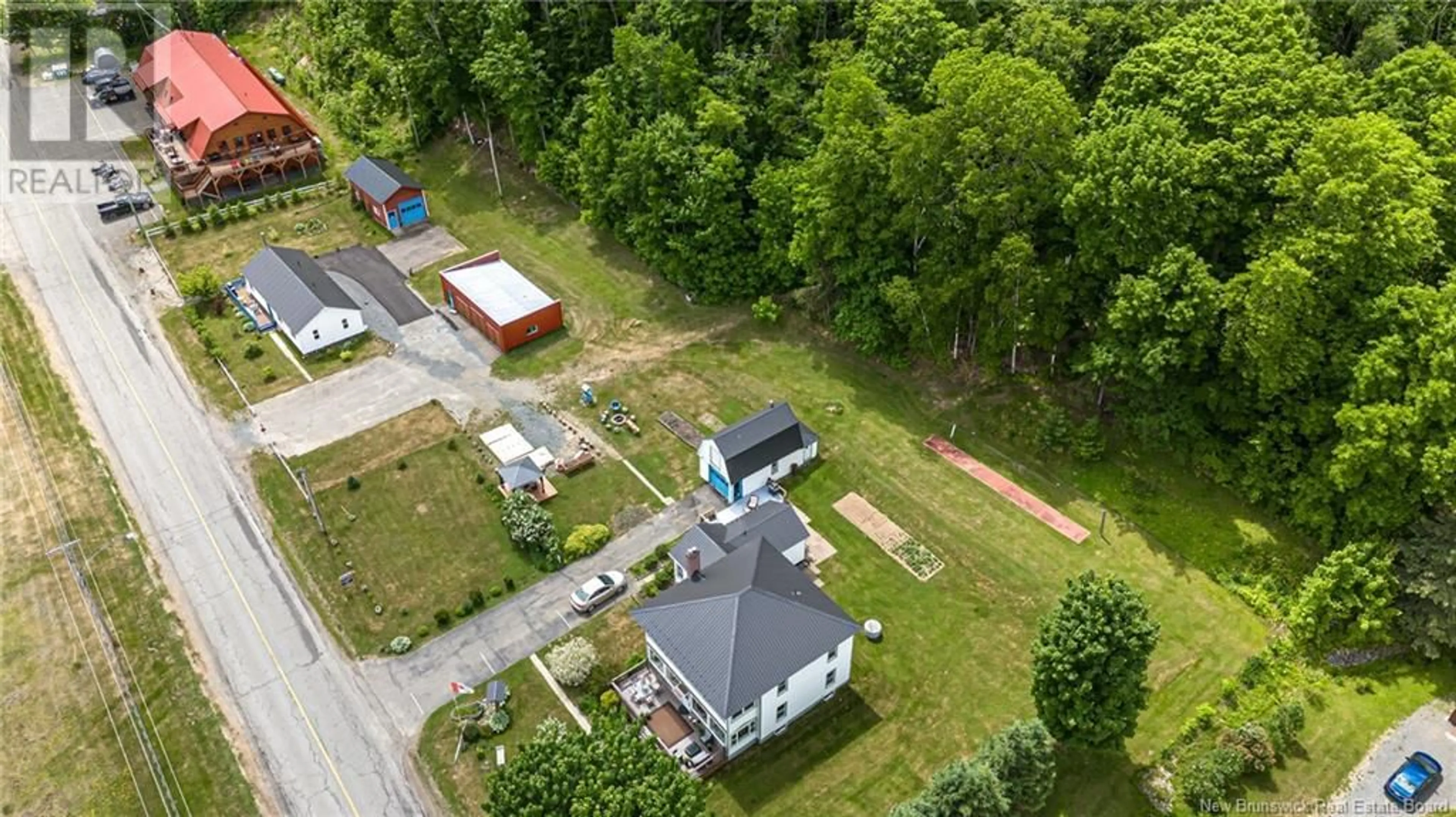 A pic from outside/outdoor area/front of a property/back of a property/a pic from drone, unknown for 519-531 OTIS DRIVE, Nackawic New Brunswick E6G1H6