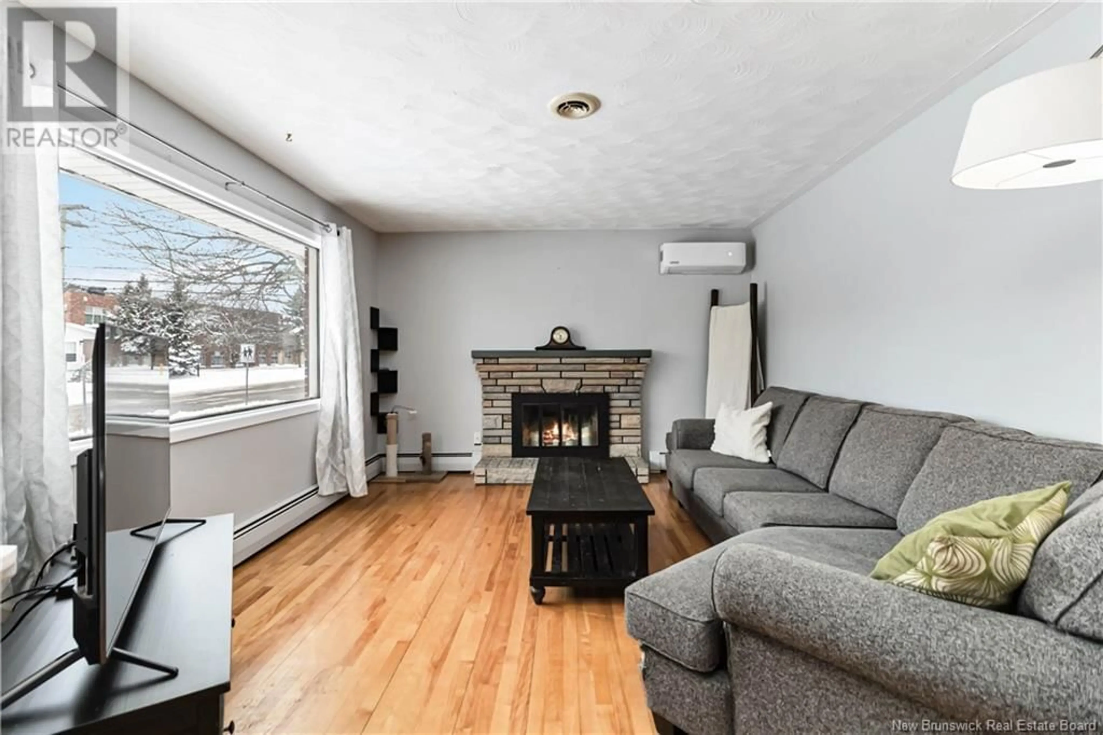 Living room with furniture, wood/laminate floor for 235 Ayer Avenue, Moncton New Brunswick E1C8H1