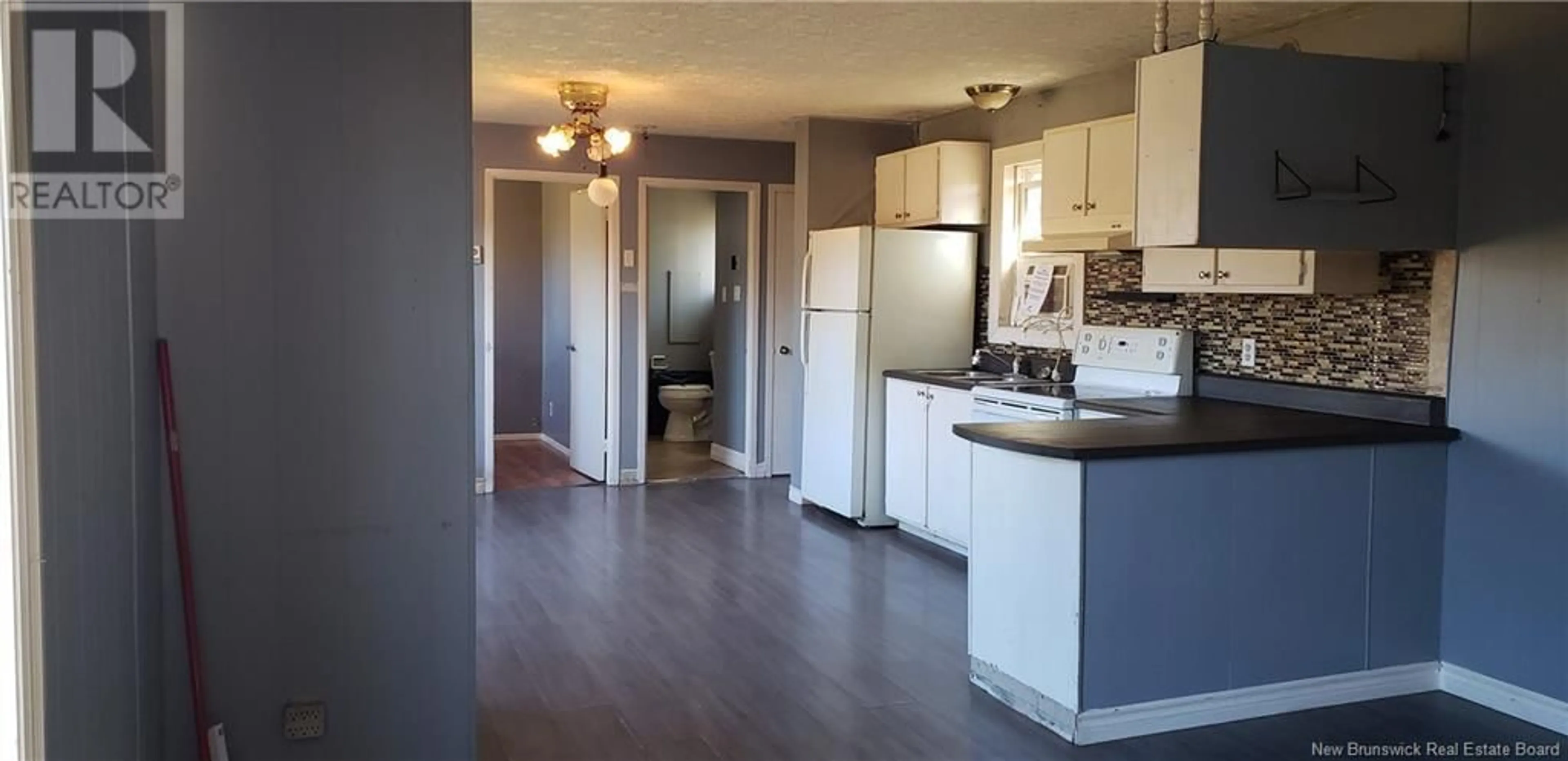 Open concept kitchen, wood/laminate floor for 464 104 Rte, Burtts Corner New Brunswick E6L2B1