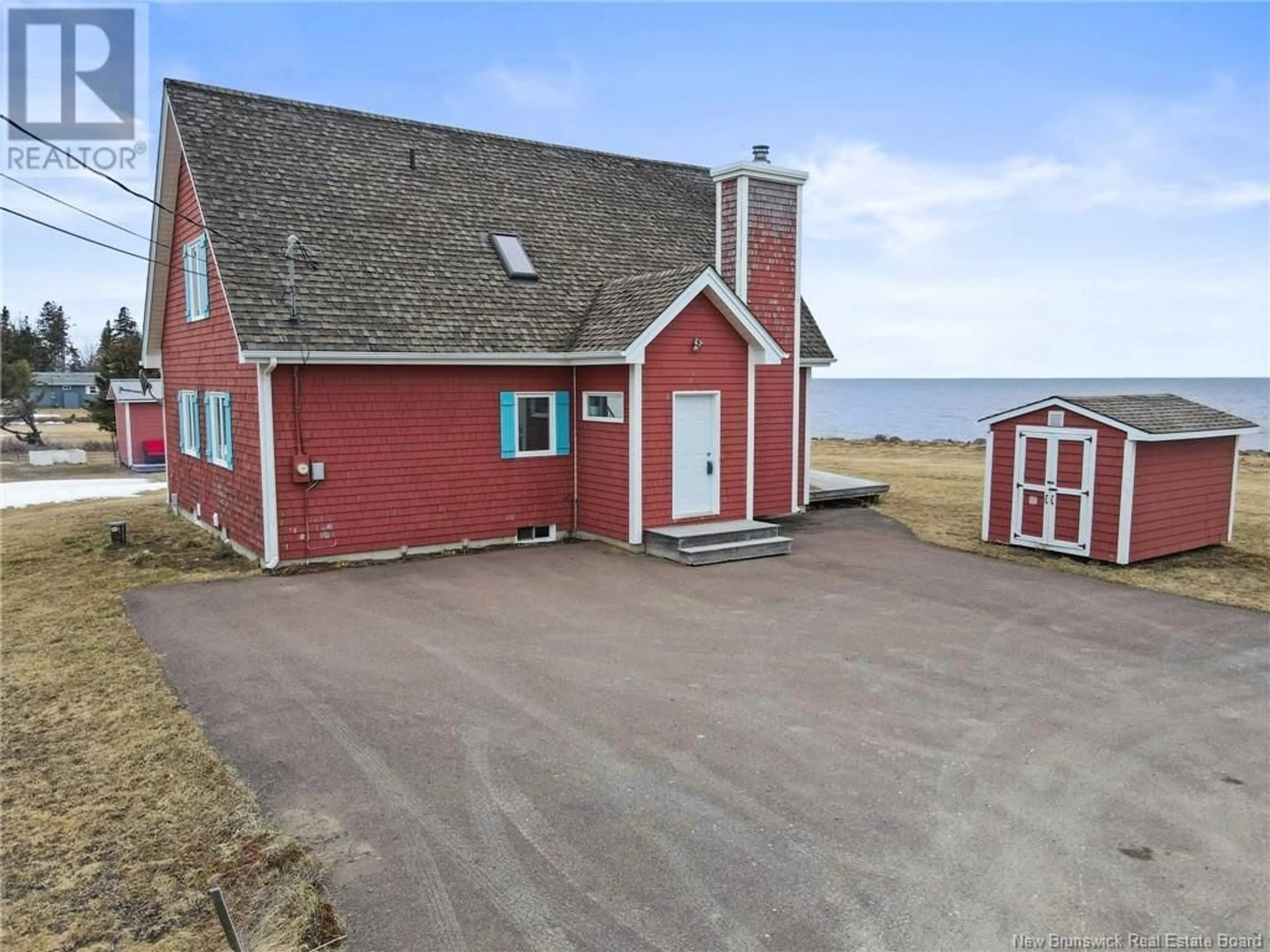 A pic from outside/outdoor area/front of a property/back of a property/a pic from drone, water/lake/river/ocean view for 23 Power Street, Grande-Digue New Brunswick E4R5W2