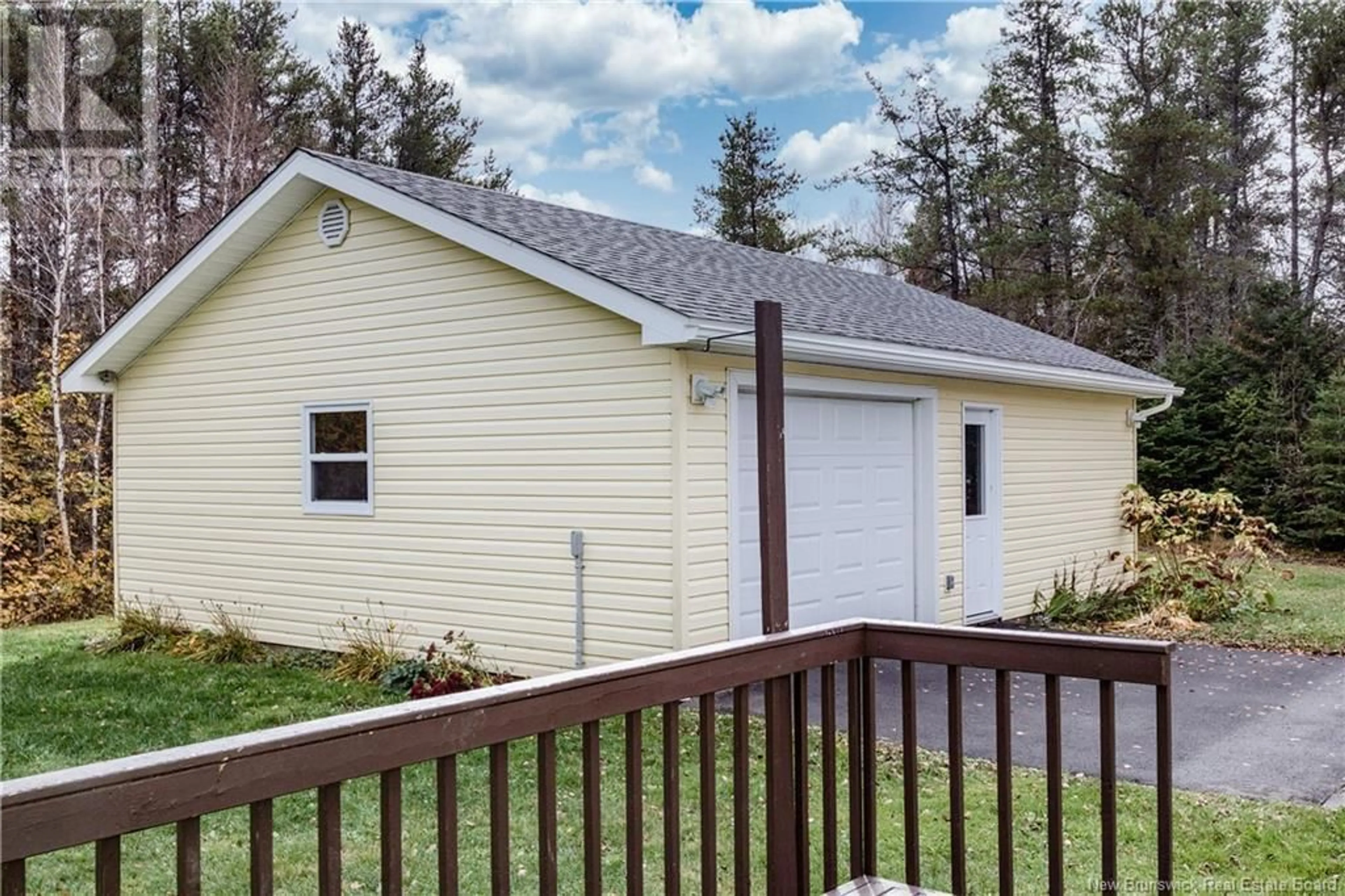 Home with vinyl exterior material, street for 50 Pointe de l'Eglise, Aldouane New Brunswick E4W5H2