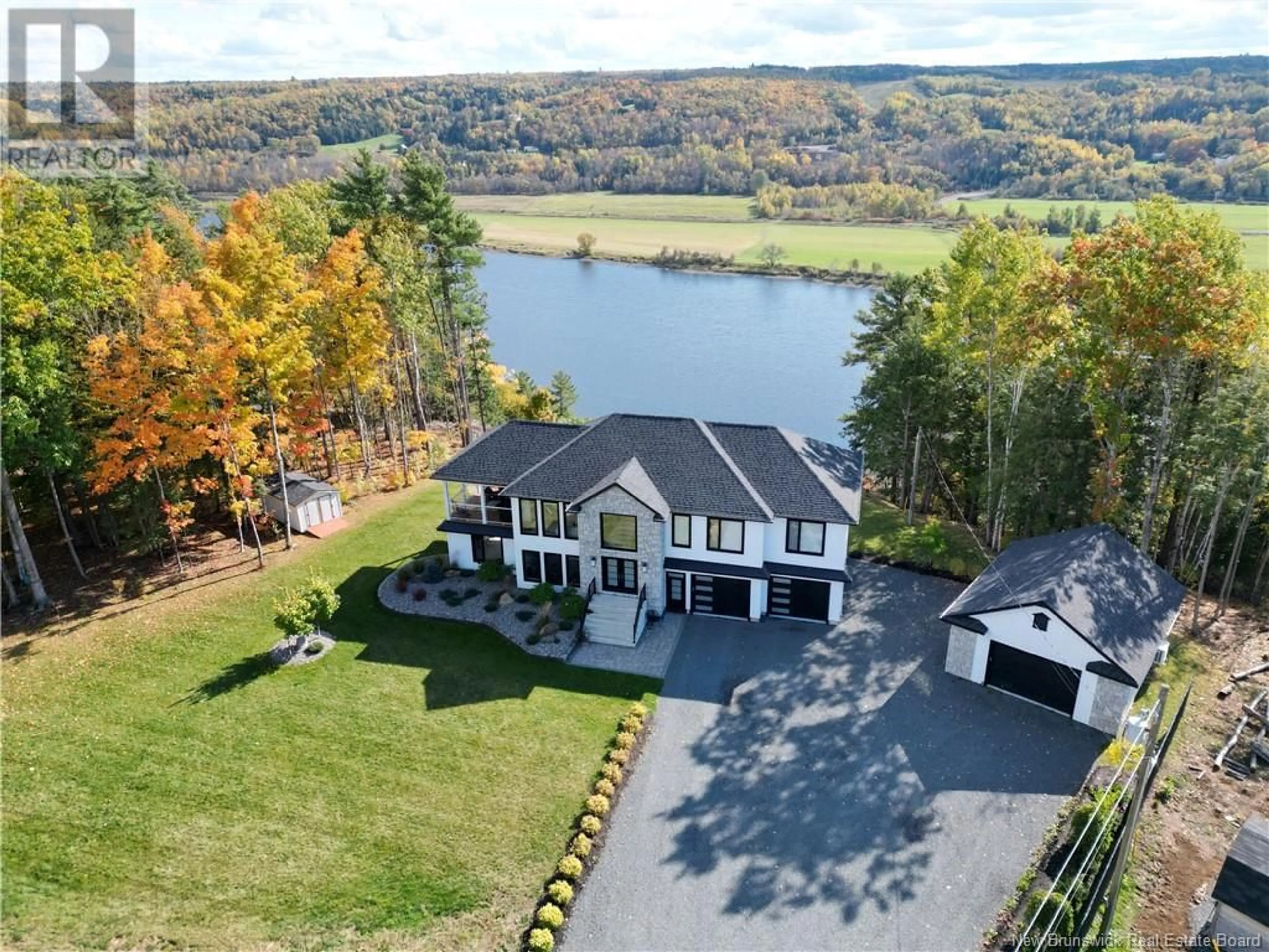 A pic from outside/outdoor area/front of a property/back of a property/a pic from drone, water/lake/river/ocean view for 230 Crocks Point Road, Keswick Ridge New Brunswick E6L1T7