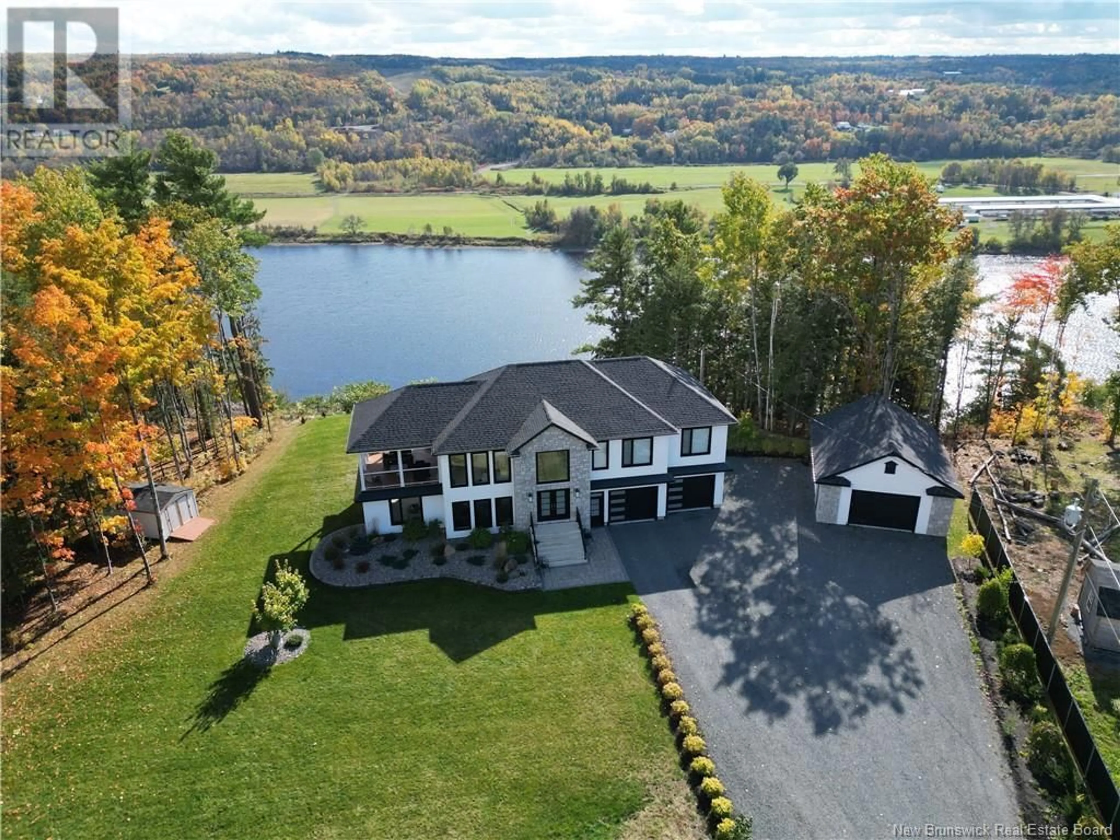 A pic from outside/outdoor area/front of a property/back of a property/a pic from drone, water/lake/river/ocean view for 230 Crocks Point Road, Keswick Ridge New Brunswick E6L1T7