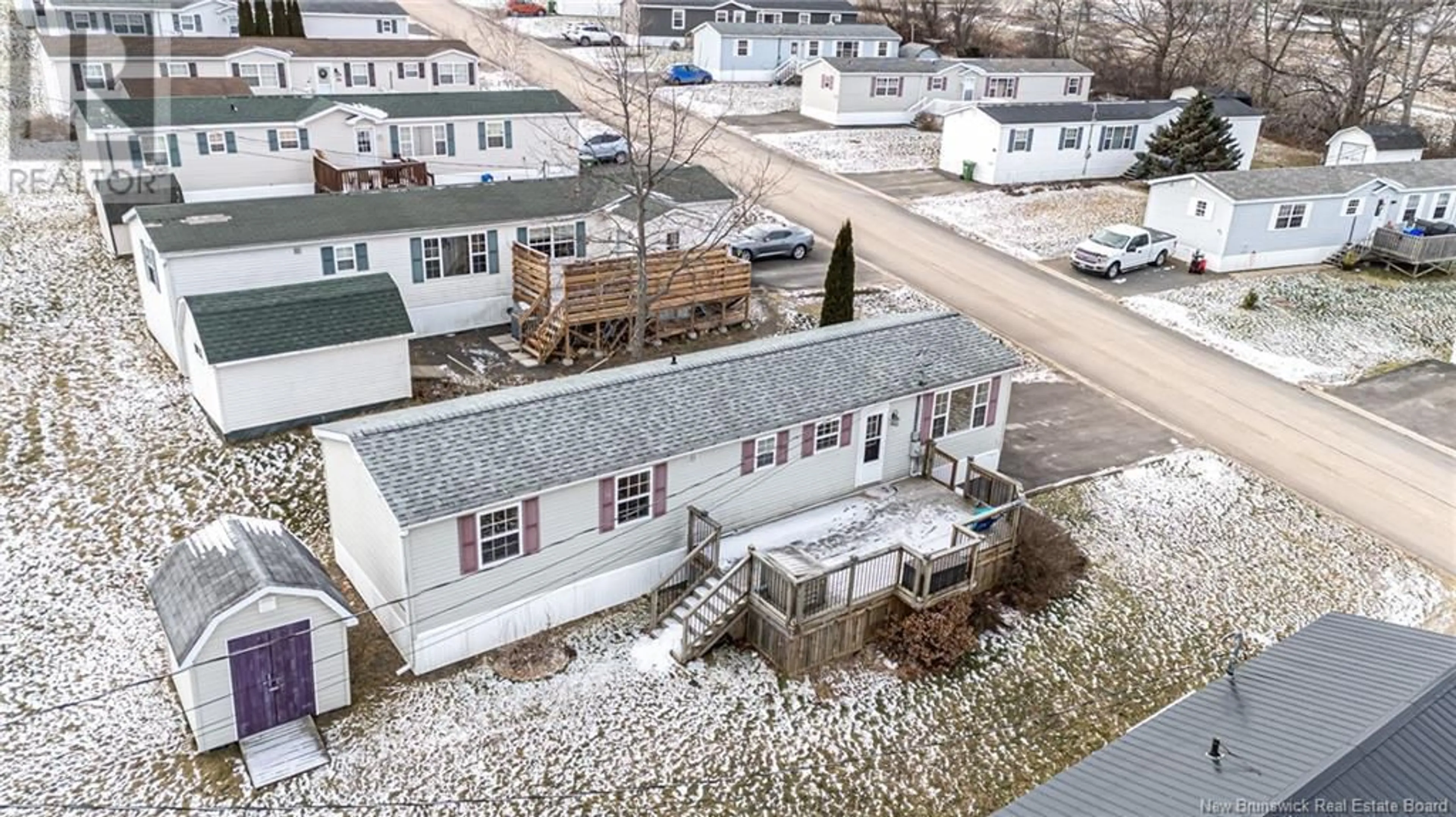 A pic from outside/outdoor area/front of a property/back of a property/a pic from drone, street for 32 Todd Street, Fredericton New Brunswick E3C2M4