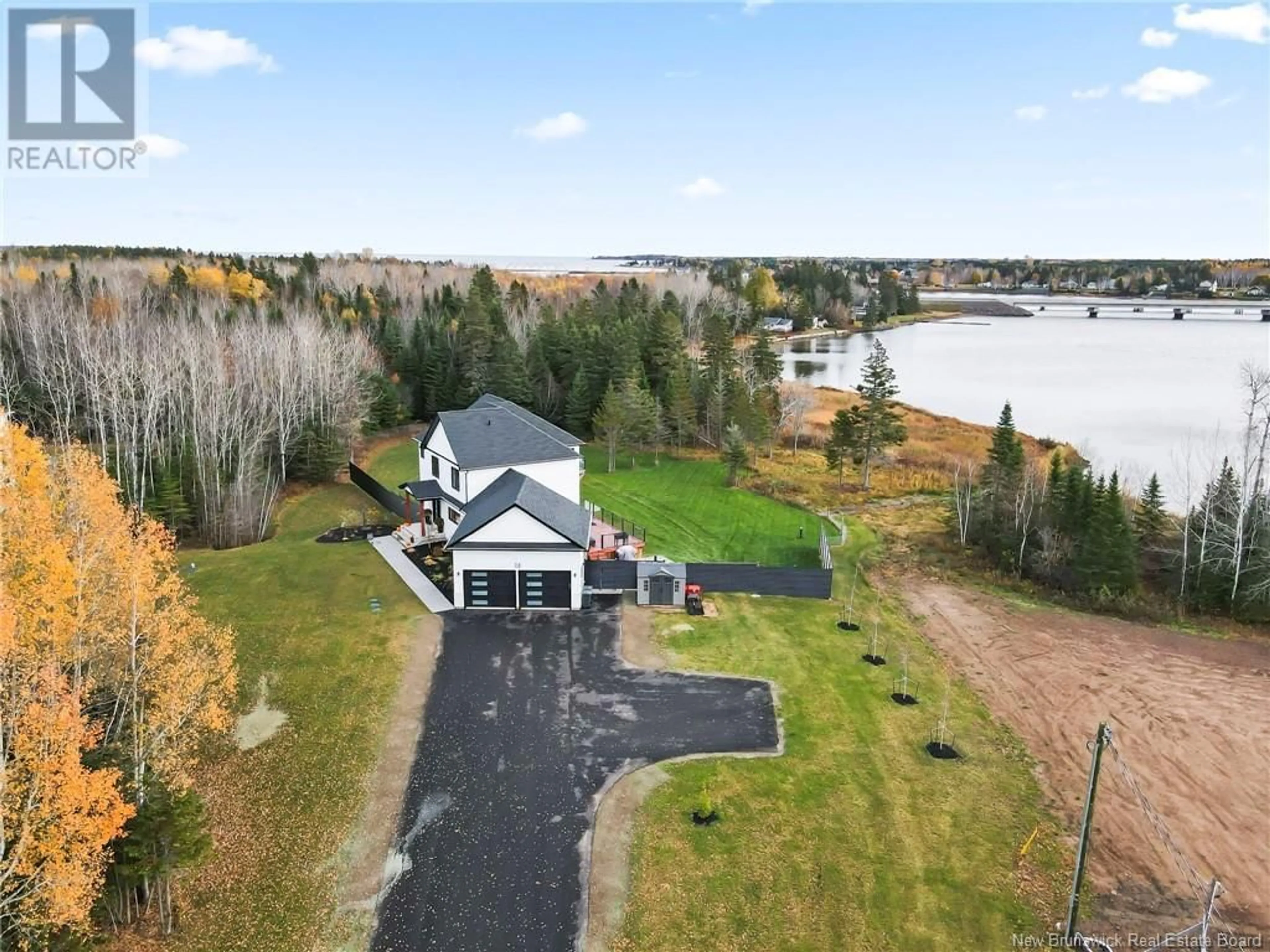 A pic from outside/outdoor area/front of a property/back of a property/a pic from drone, water/lake/river/ocean view for 74 Waterfront Drive, Shediac Bridge New Brunswick E4R0G1