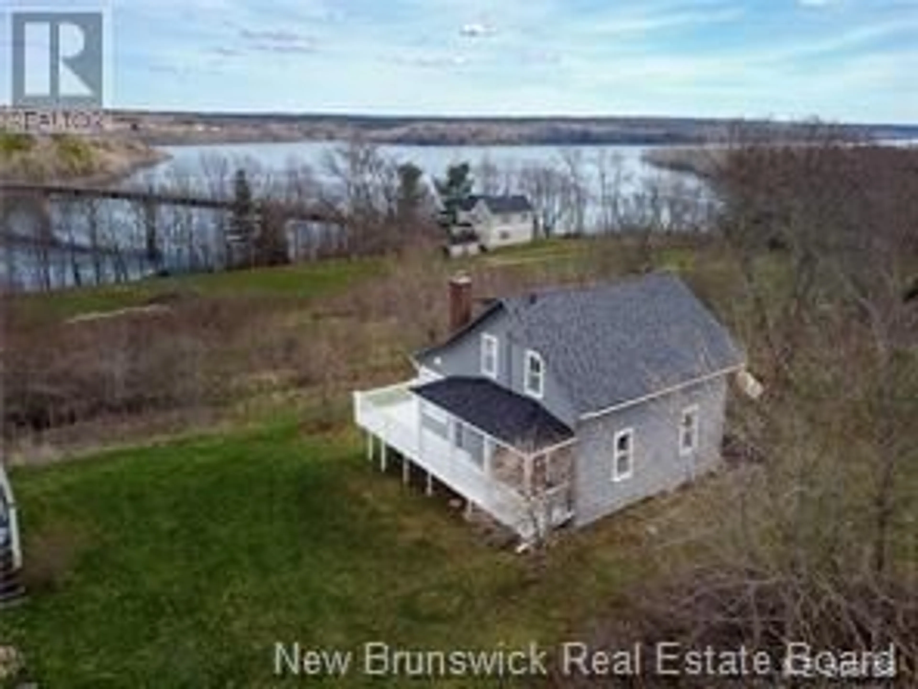 A pic from outside/outdoor area/front of a property/back of a property/a pic from drone, water/lake/river/ocean view for 2221 Lakeview Road, Cambridge-Narrows New Brunswick E4C1N7