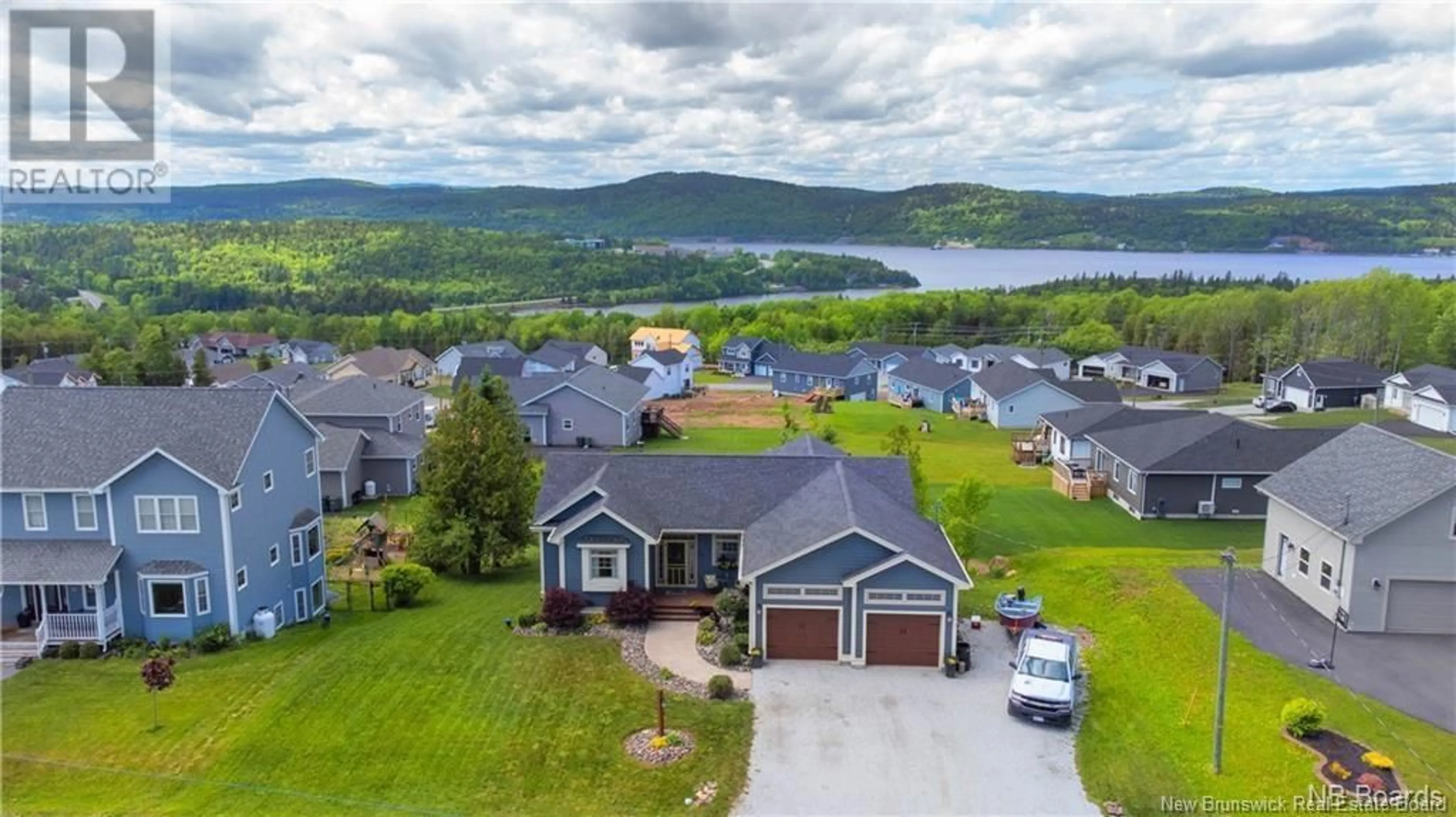 A pic from outside/outdoor area/front of a property/back of a property/a pic from drone, water/lake/river/ocean view for 19 Pioneer Avenue, Quispamsis New Brunswick E2G0B1