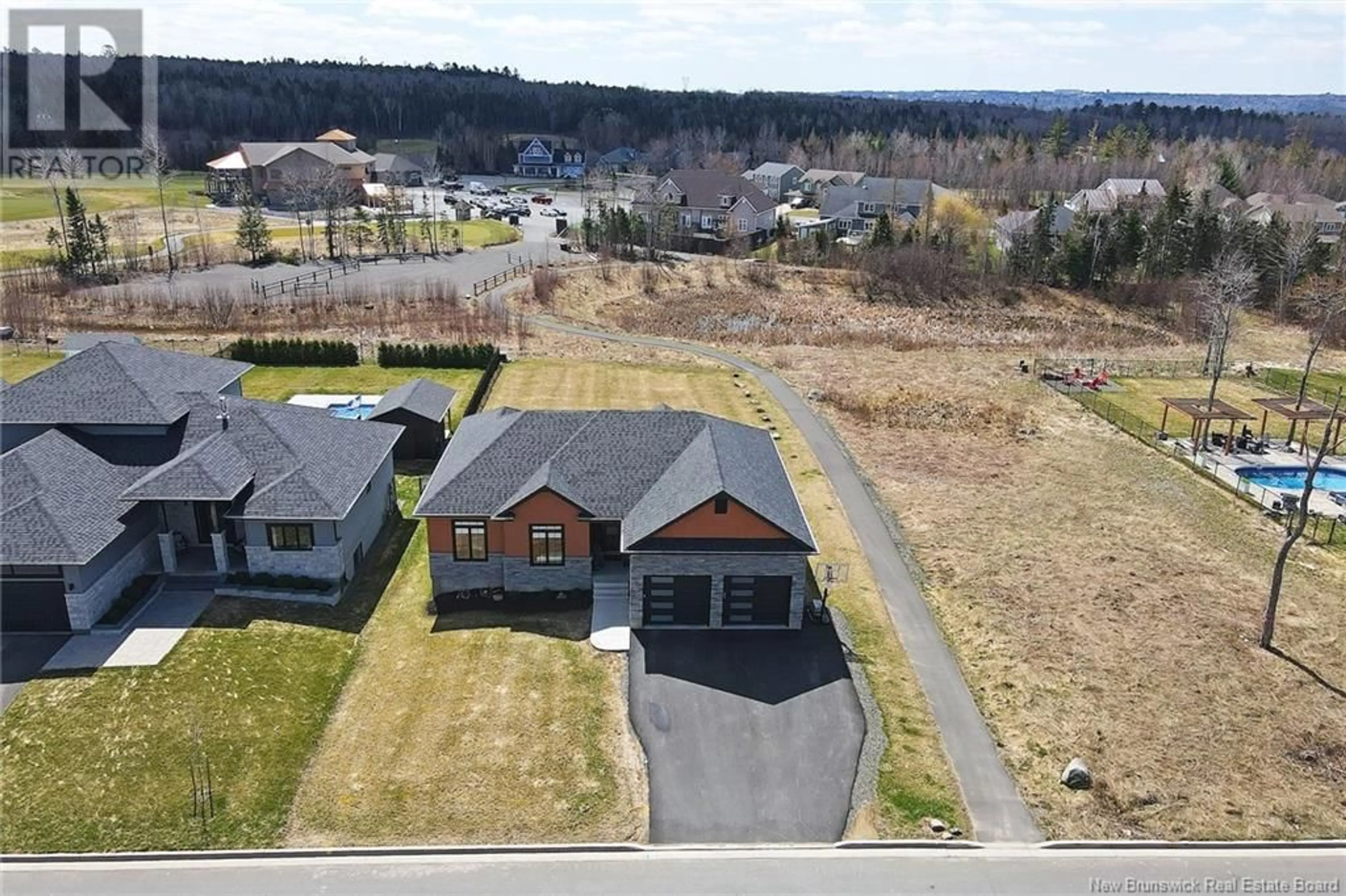 A pic from outside/outdoor area/front of a property/back of a property/a pic from drone, street for 56 Stonehill Lane, Fredericton New Brunswick E3G0E9