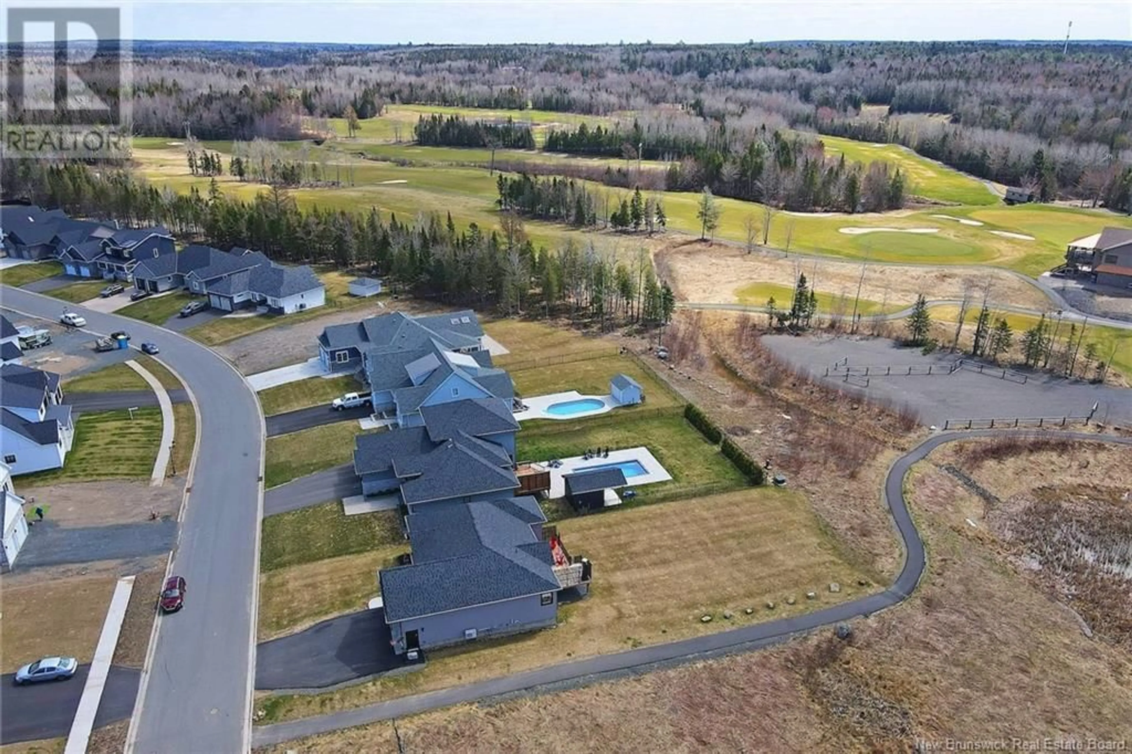 A pic from outside/outdoor area/front of a property/back of a property/a pic from drone, water/lake/river/ocean view for 56 Stonehill Lane, Fredericton New Brunswick E3G0E9