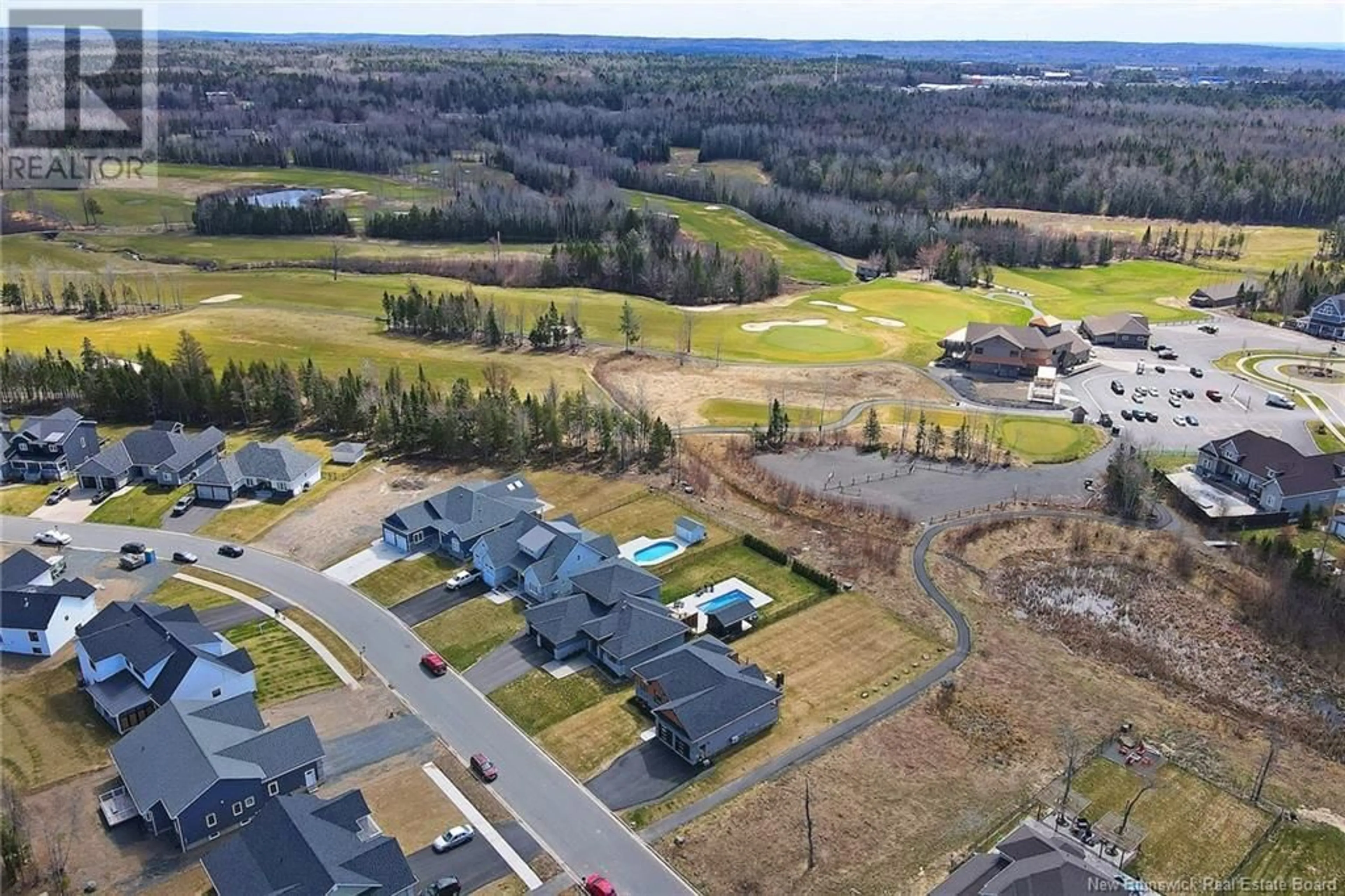 A pic from outside/outdoor area/front of a property/back of a property/a pic from drone, water/lake/river/ocean view for 56 Stonehill Lane, Fredericton New Brunswick E3G0E9