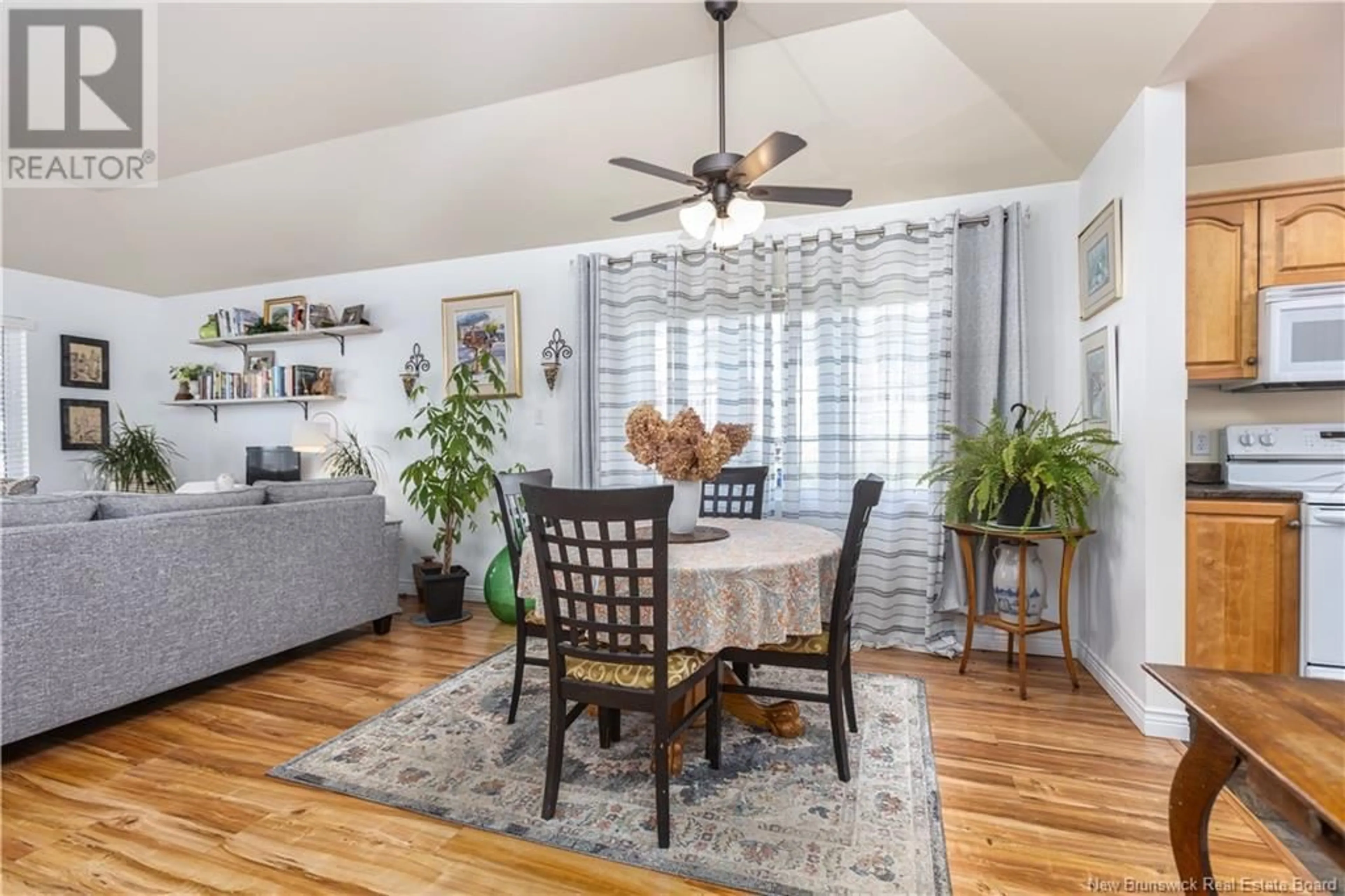 Living room with furniture, wood/laminate floor for 9 Village Lane, Moncton New Brunswick E1A7Y8