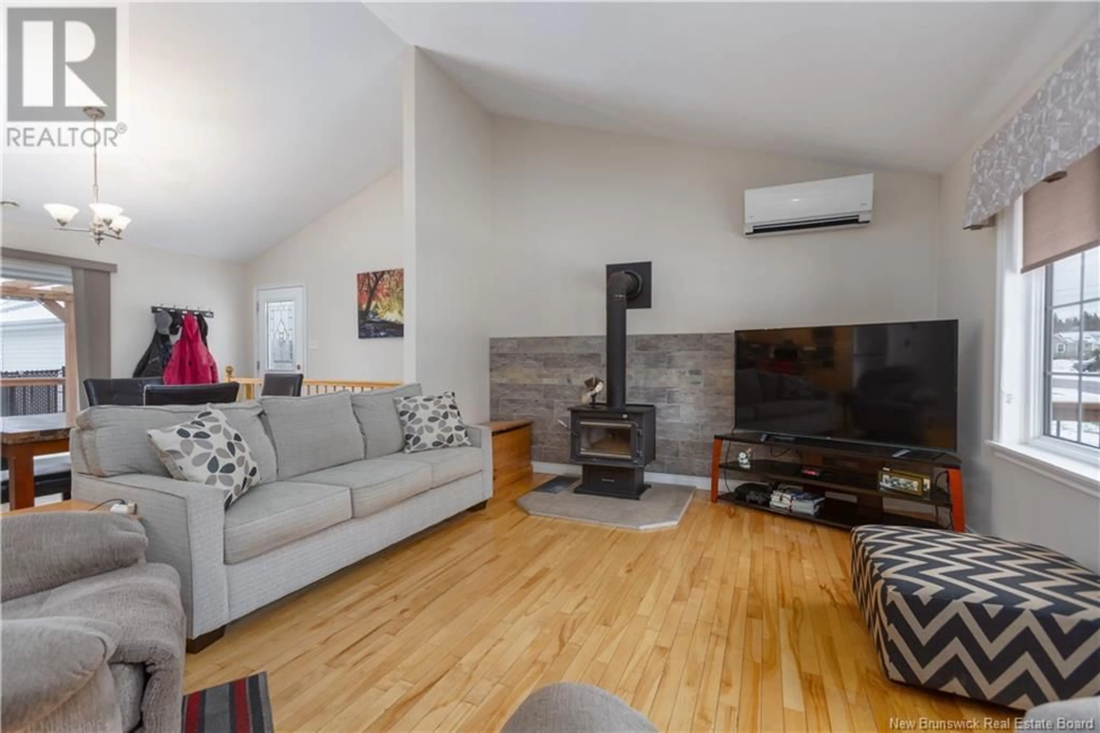 Living room with furniture, wood/laminate floor for 54 Nicolas Street, Dieppe New Brunswick E1A8L7