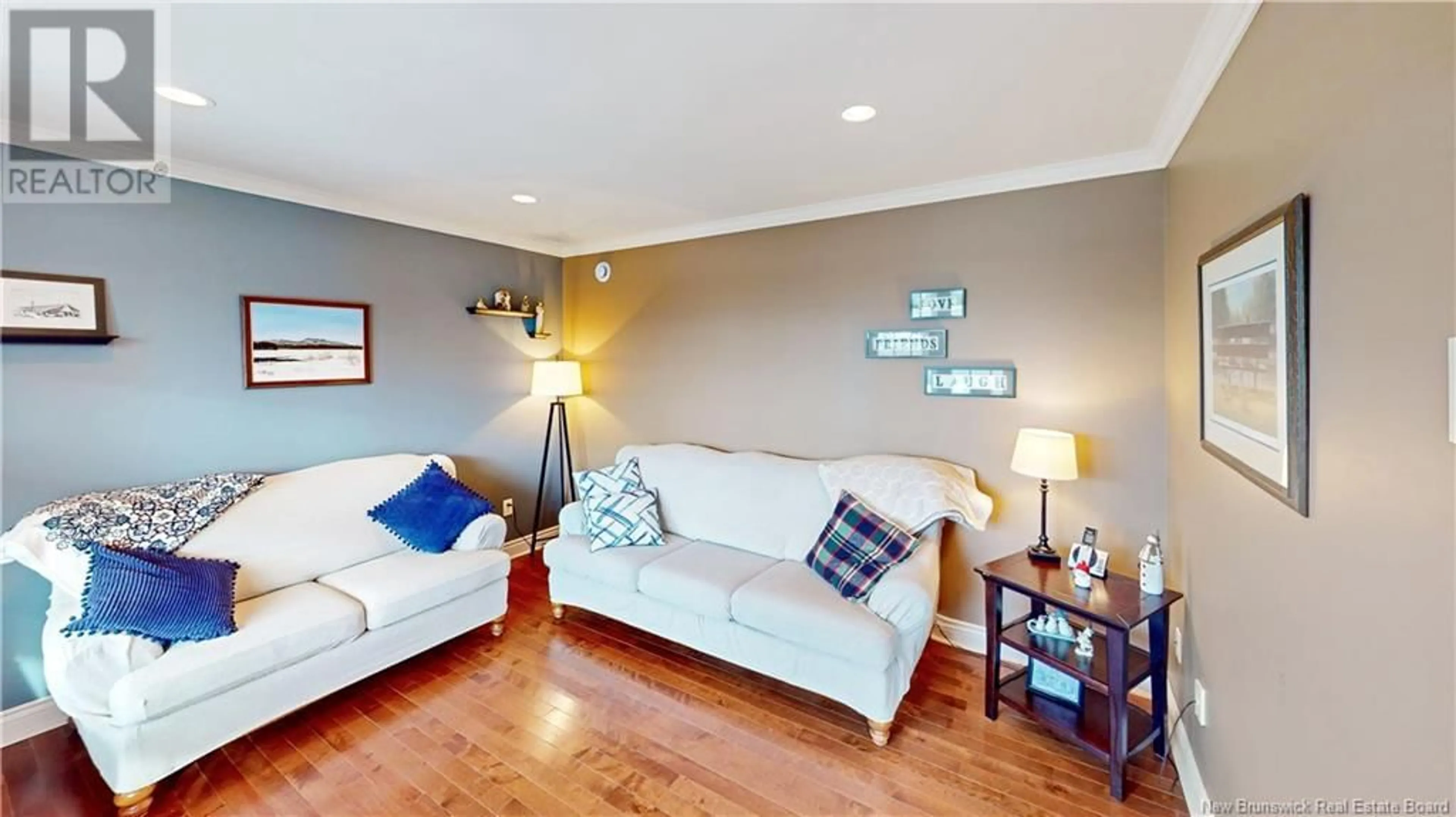 Living room with furniture, wood/laminate floor for 31 Grasmere Avenue, Quispamsis New Brunswick E2E0B5