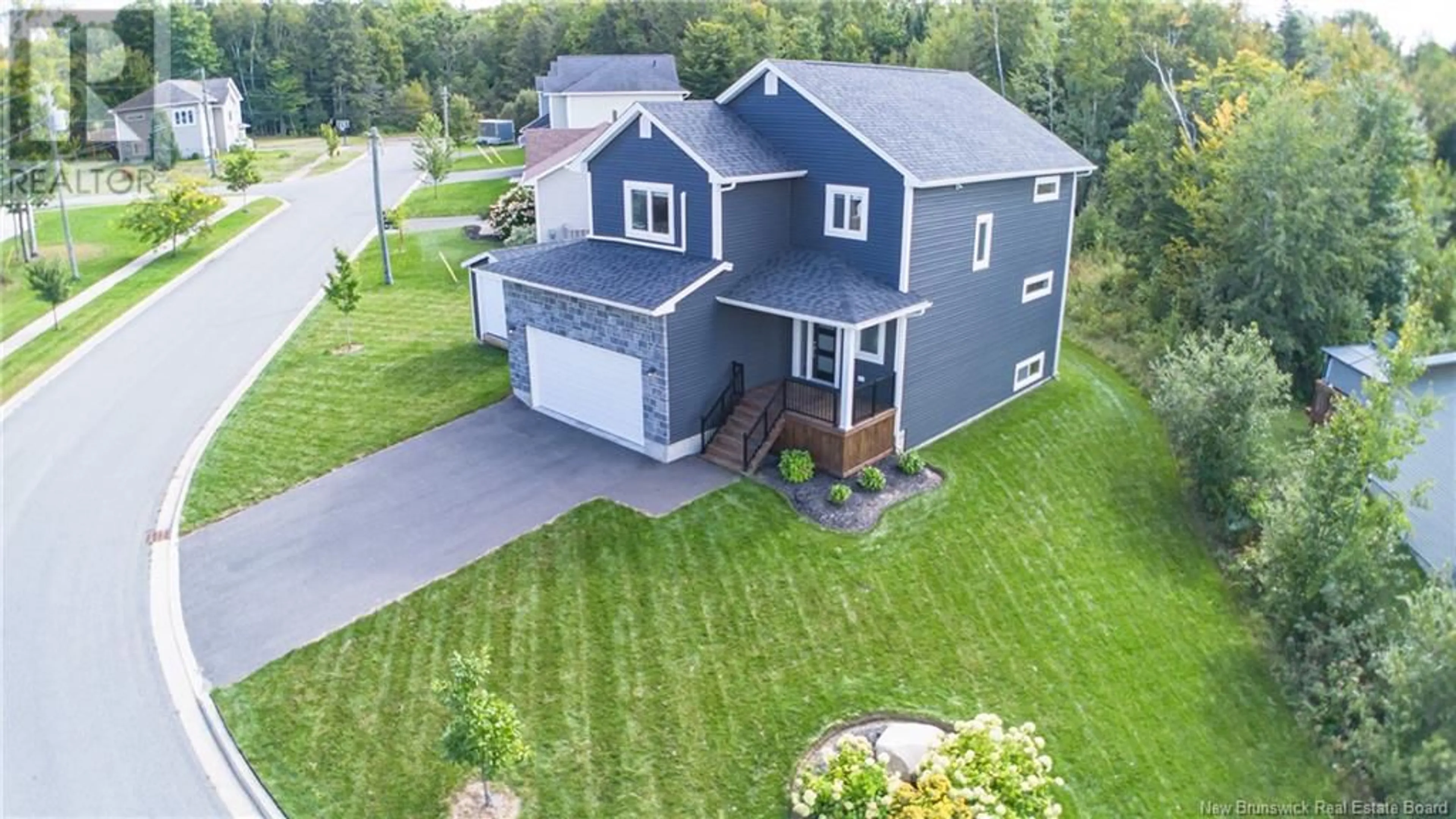 A pic from outside/outdoor area/front of a property/back of a property/a pic from drone, street for 46 Whisperwood Drive, Fredericton New Brunswick E3C0J7